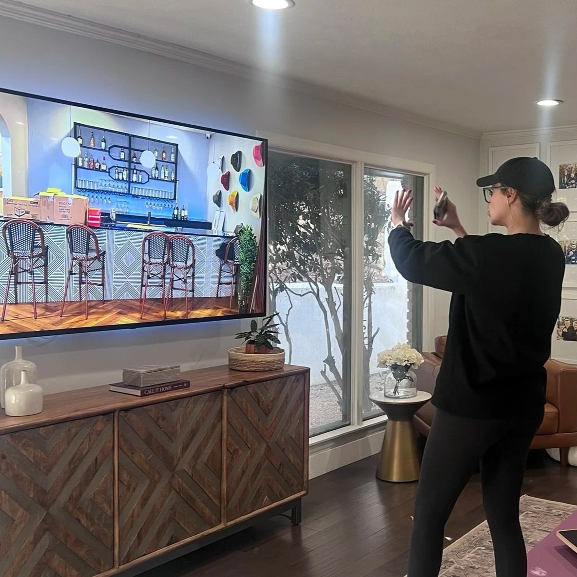 Interior plant designer evaluating a client's home during an in home consultation in Fort Worth, Texas before creating a custom indoor plant design.