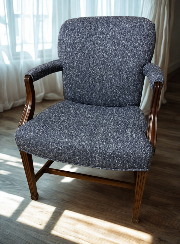 Blue bouclé fabric upholstered on a wooden antique chair