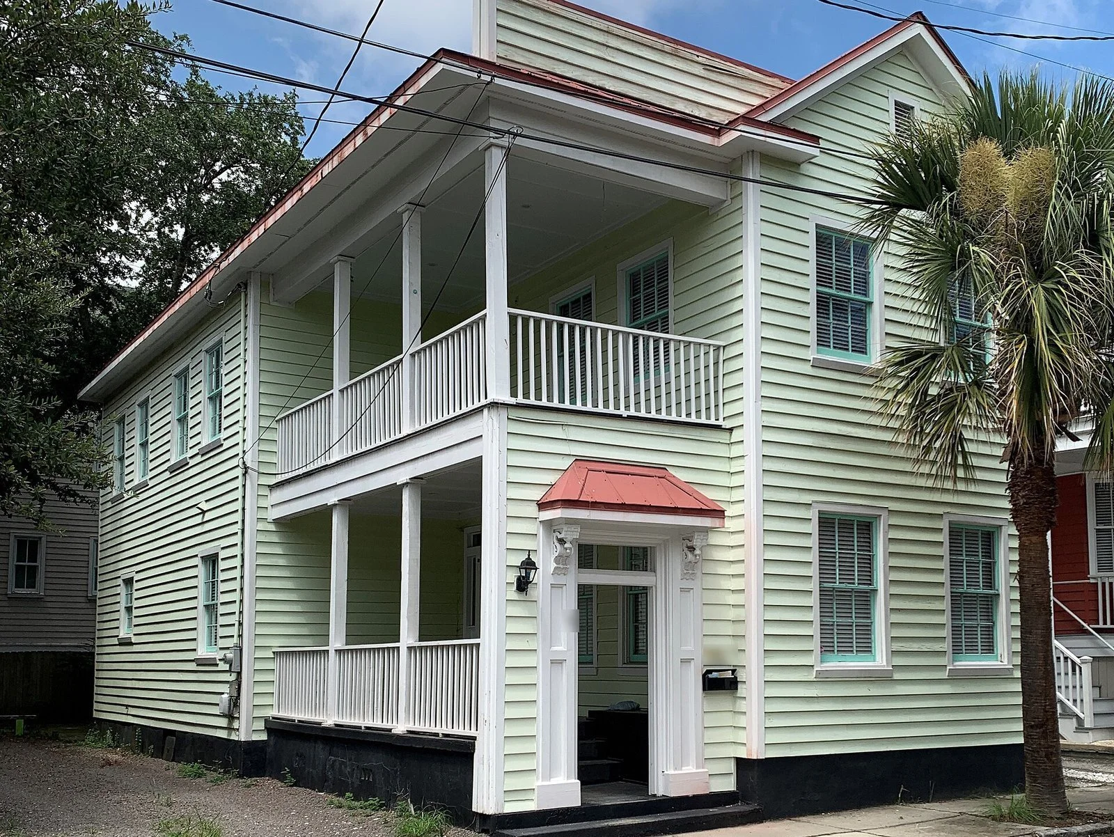 Two-story Charleston single house with double porches on Felix Street in Cannonborough-Elliotborough, Charleston SC