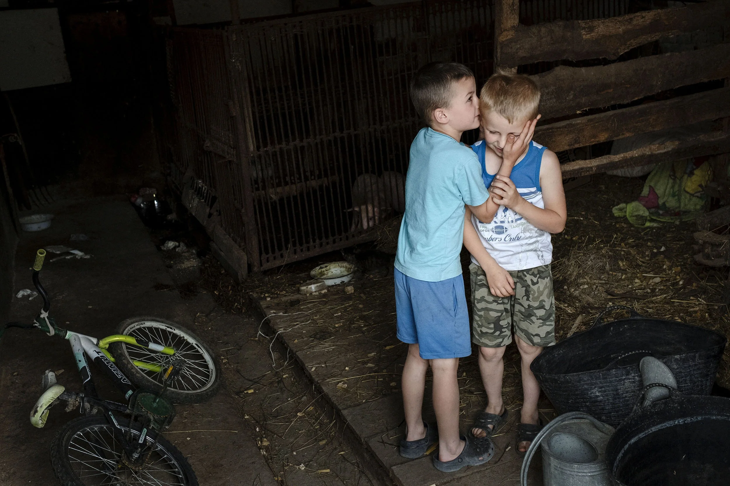 Stasic plays in a barn with his best friend.