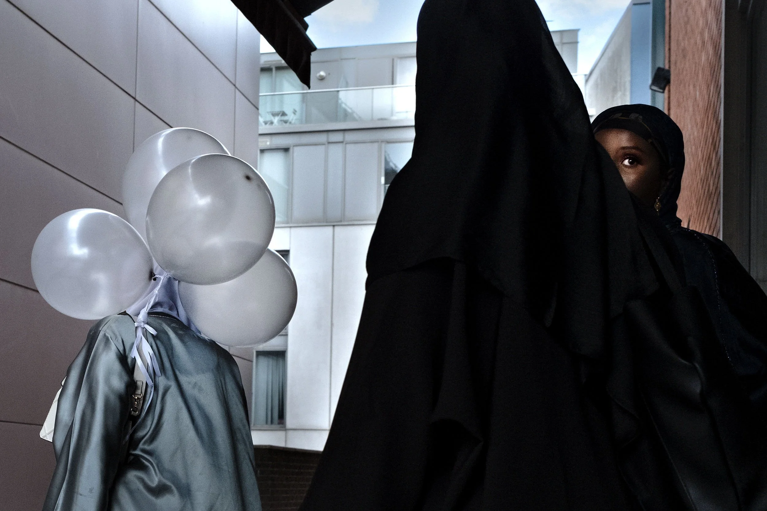 I spotted the young ladies walking into a coffee shop near the Mailbox. Birmingham, hoping to catch them on their way out, when the girl on the left looked over in my direction.