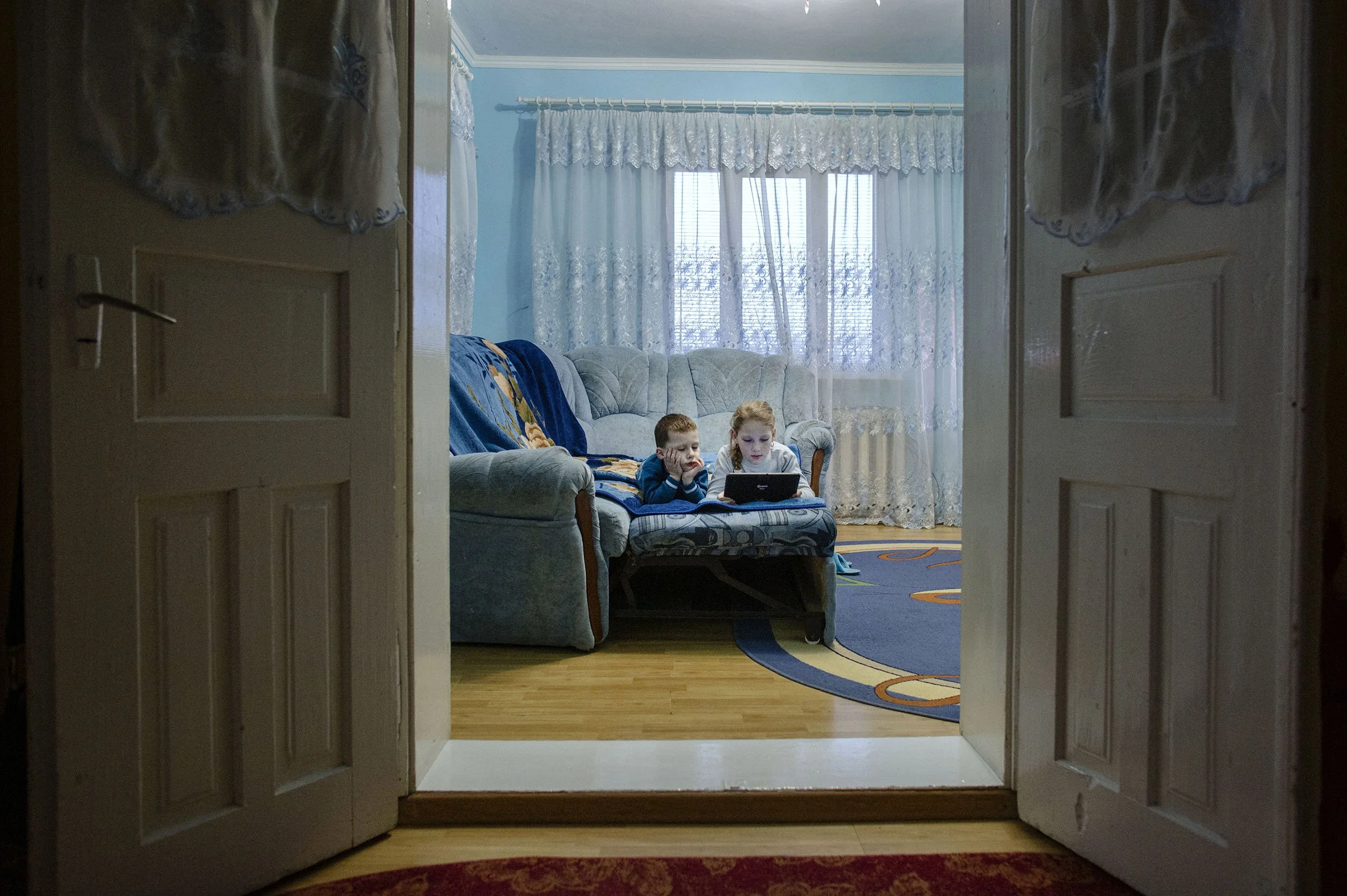 The Children of Vania,, who works in the Netherlands, are on Skype in their home in Bobivtsi.