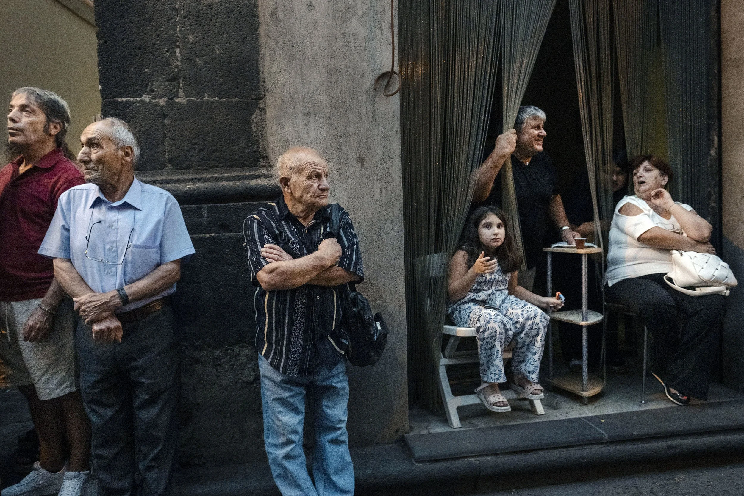 Public look at the Vara during the celebration of the assumption of Maria. The Vara is a towering, multi-layered triumphal chariot, staffed by children portraying angels, saints and the Virgin Mary. Randazzo, Sicily.