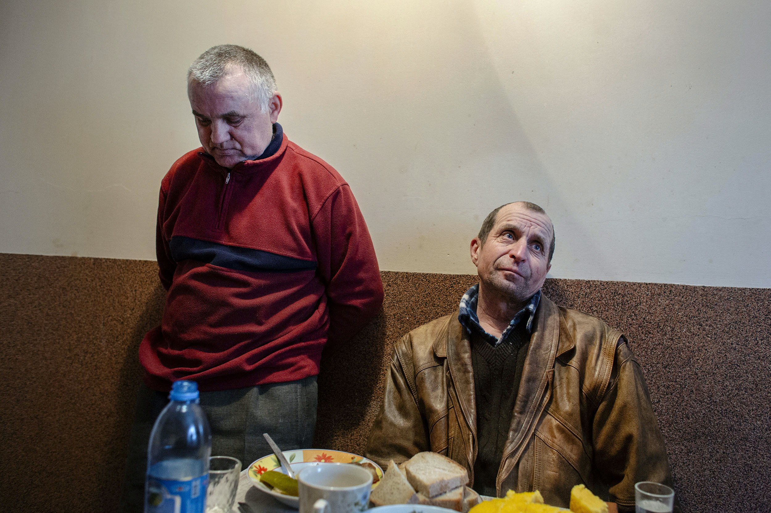 Stasic’s grandfather with a neighbour talking about their children working in Western Europe.
