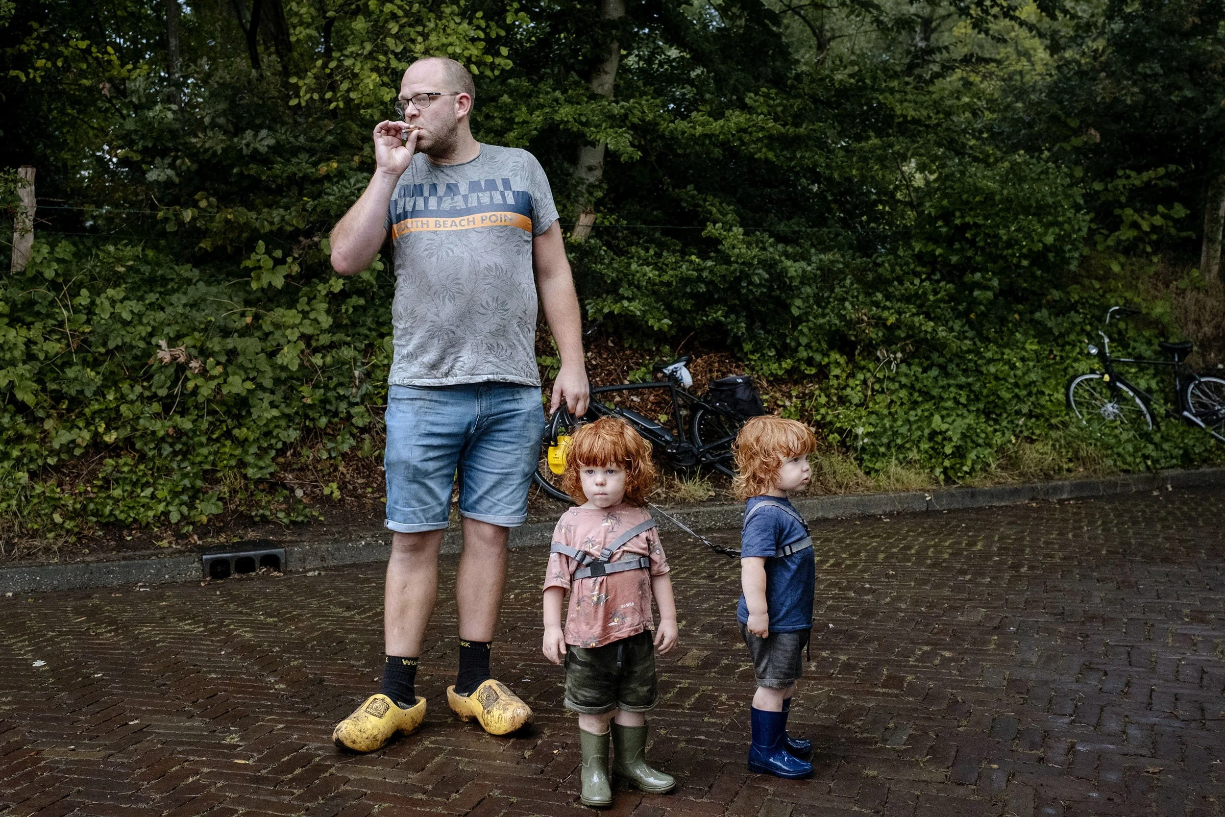 A father walking his two sons in the happiest village in the Netherlands, Hellendoorn.