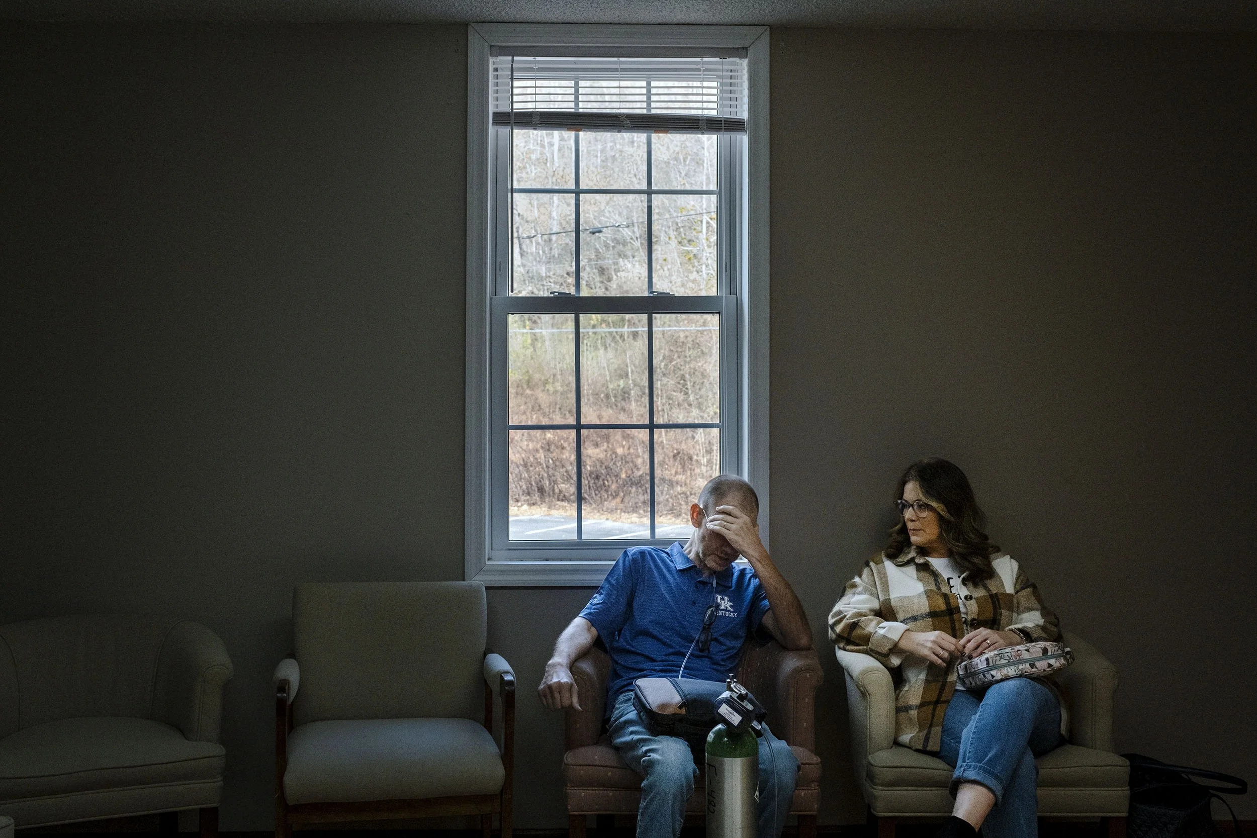 Glenn and his wife wait for bible class to start at the Faith Baptist Church, Dorton, Kentucky.