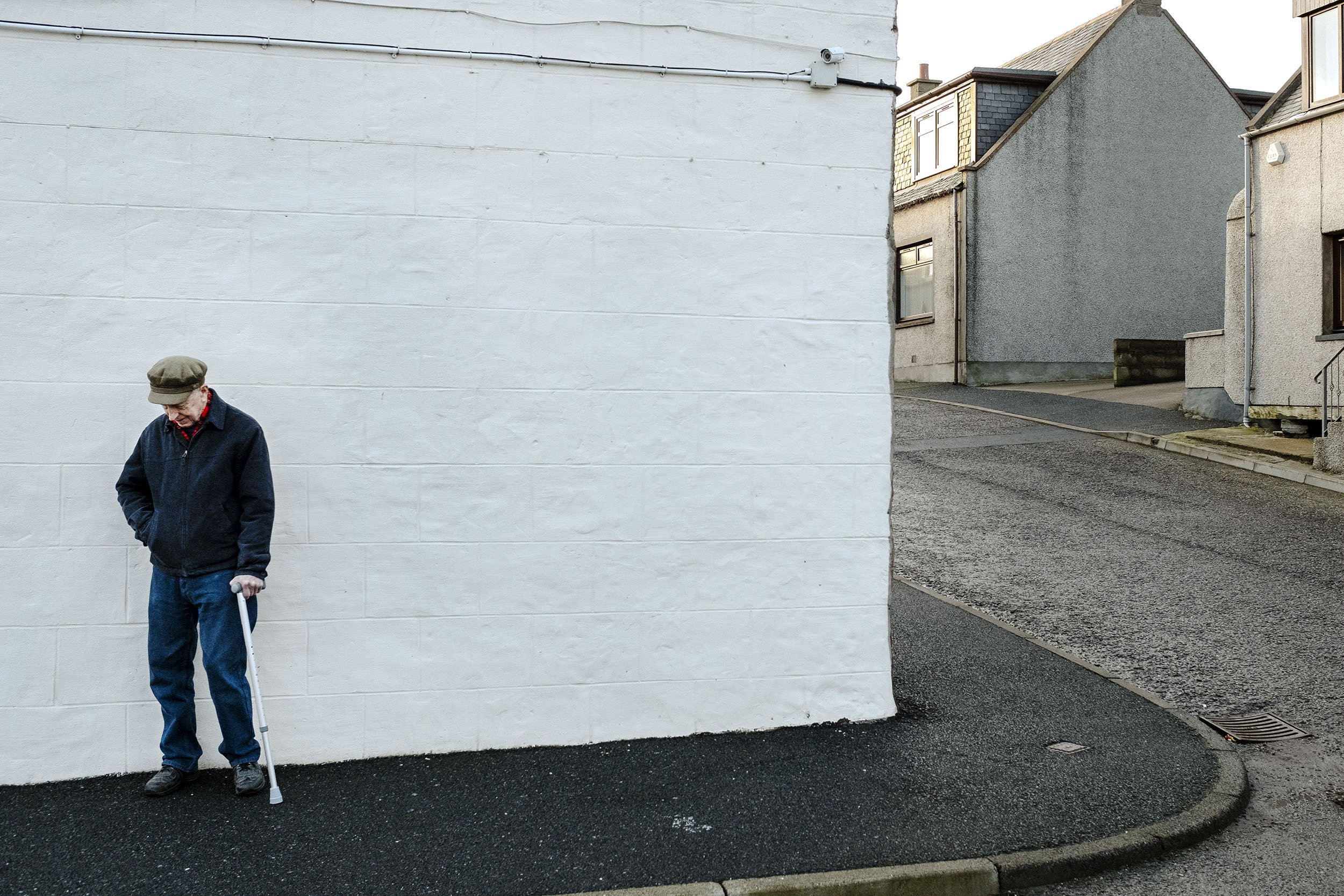 An elderly gentleman takes a rest in the Buchanhaven area, part of Peterhead, Scotland.
