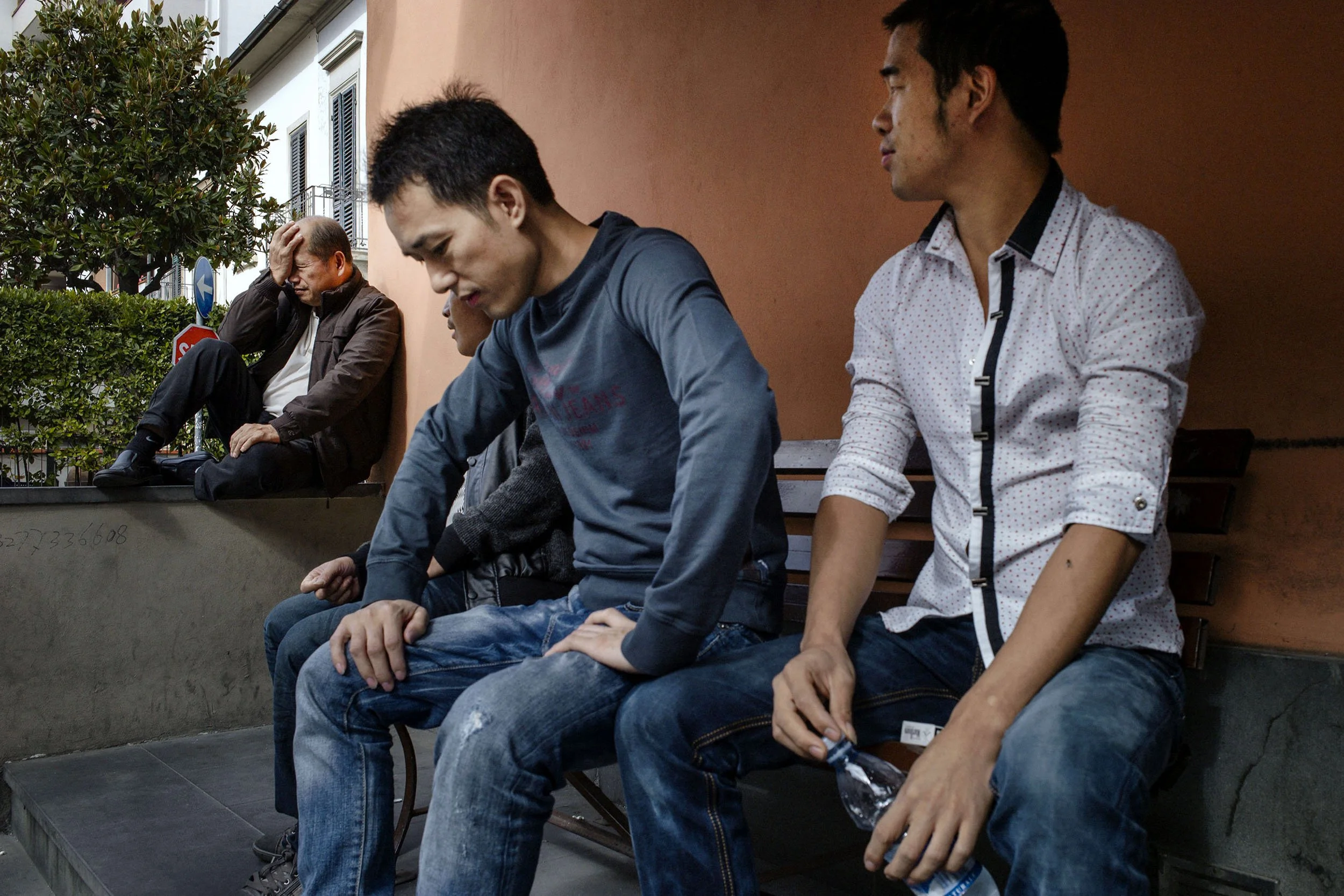 Illegal Chinese workers wait for jobs in the textile hub Prato, Italy.