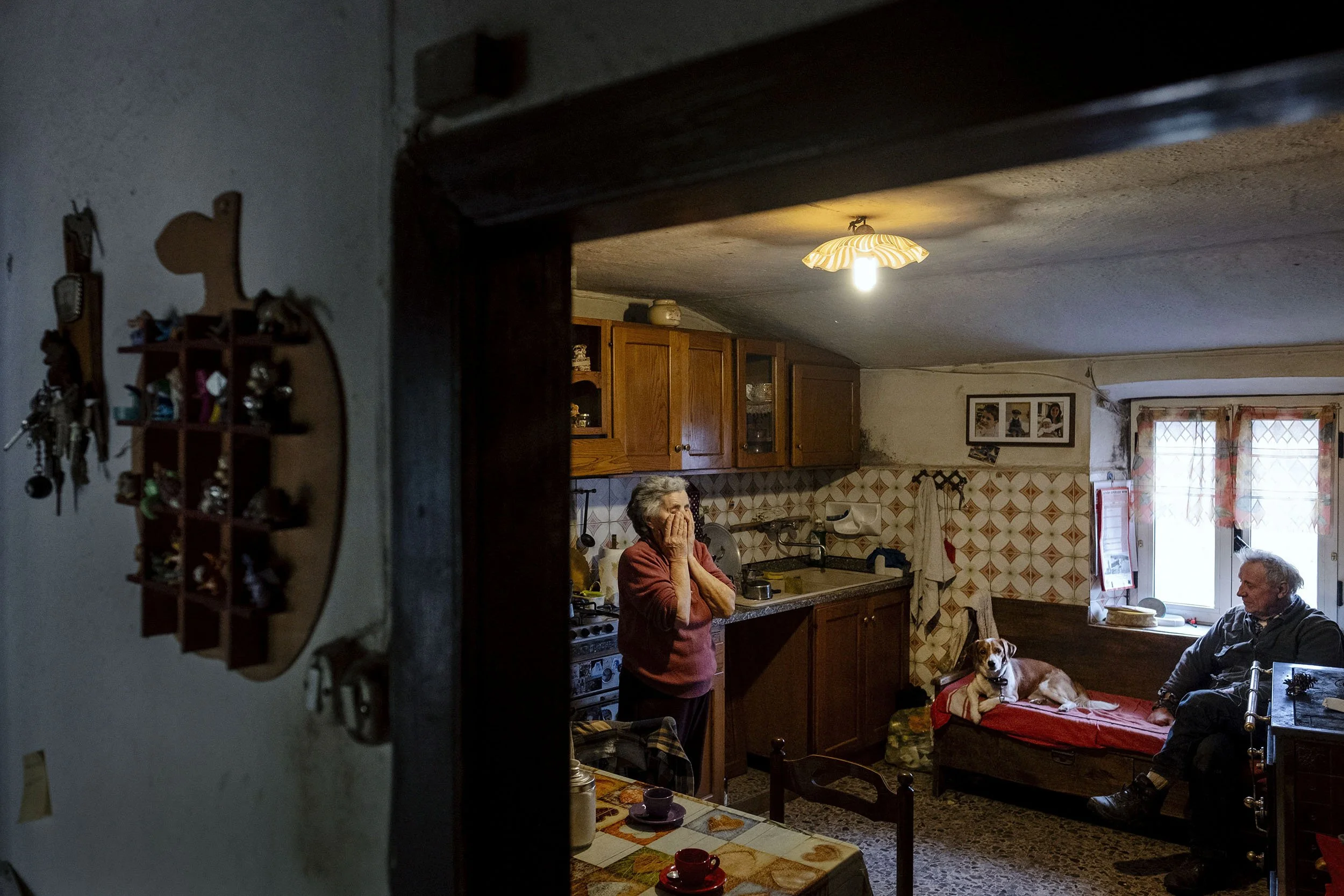 Parents of Sabina Molinari in their kitchen on their farm. Life is not easy on the small farm of thirteen cows, one calf and a donkey.
