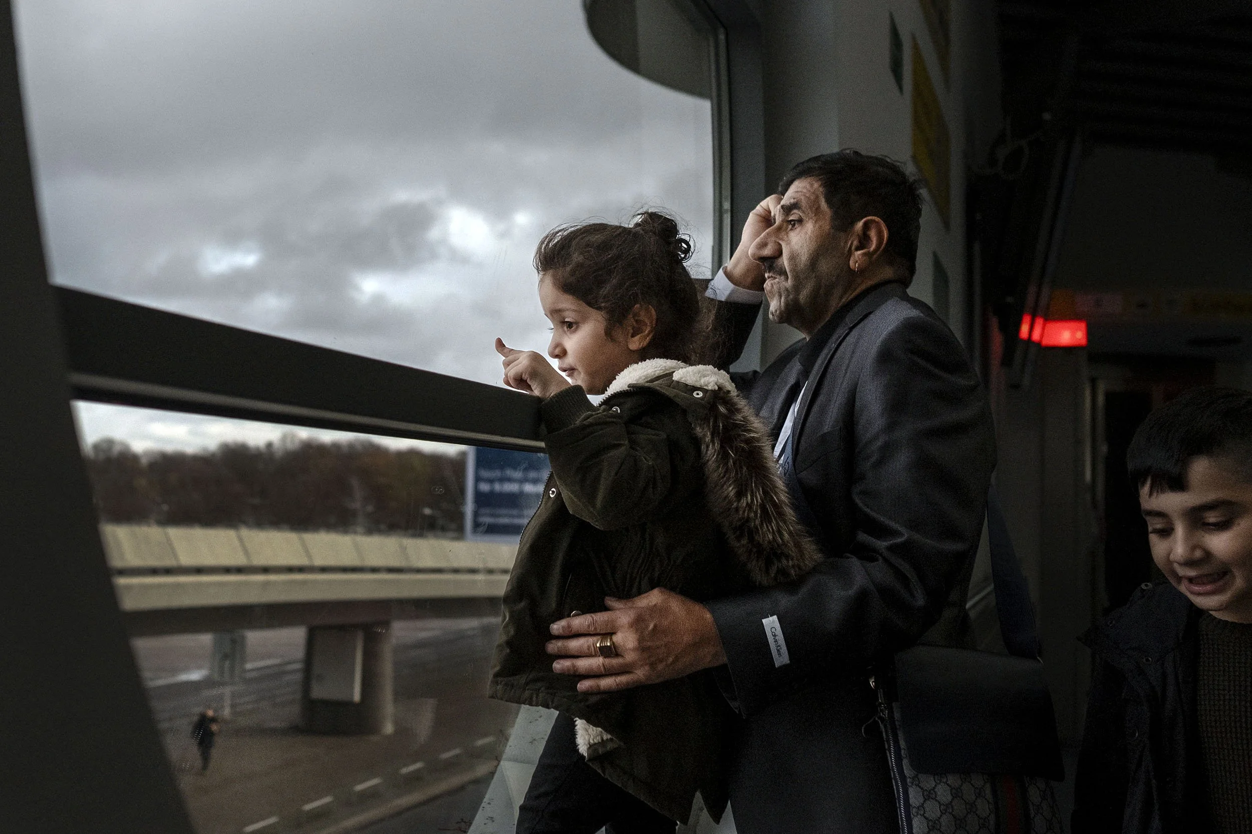 A Middle Eastern family looks on at Tegel Airport, Berlin, Germany.