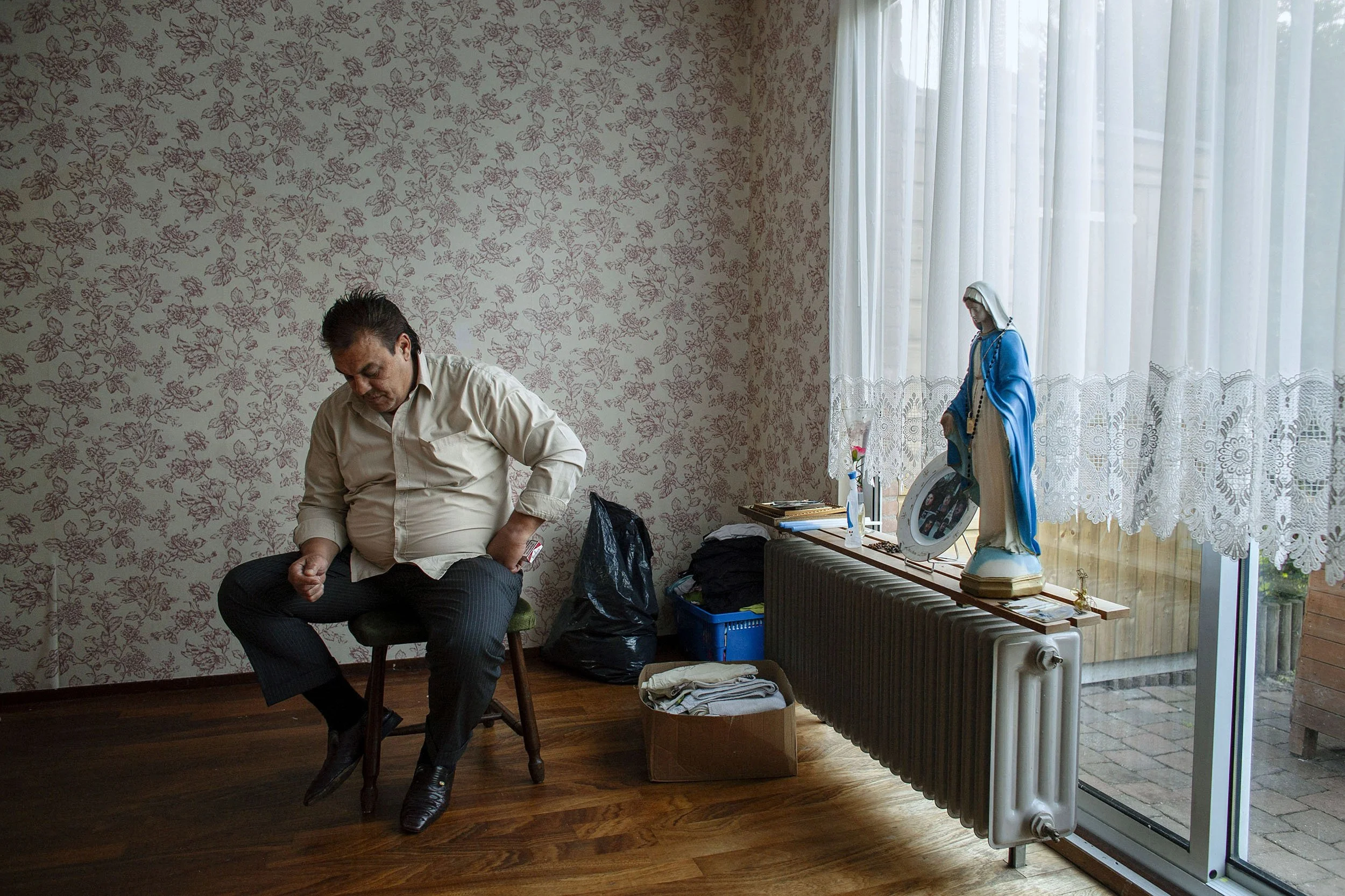 Grandfather, Nicolich, awaits eviction from his home. His wife and children left that morning. Zeist, the Netherlands.