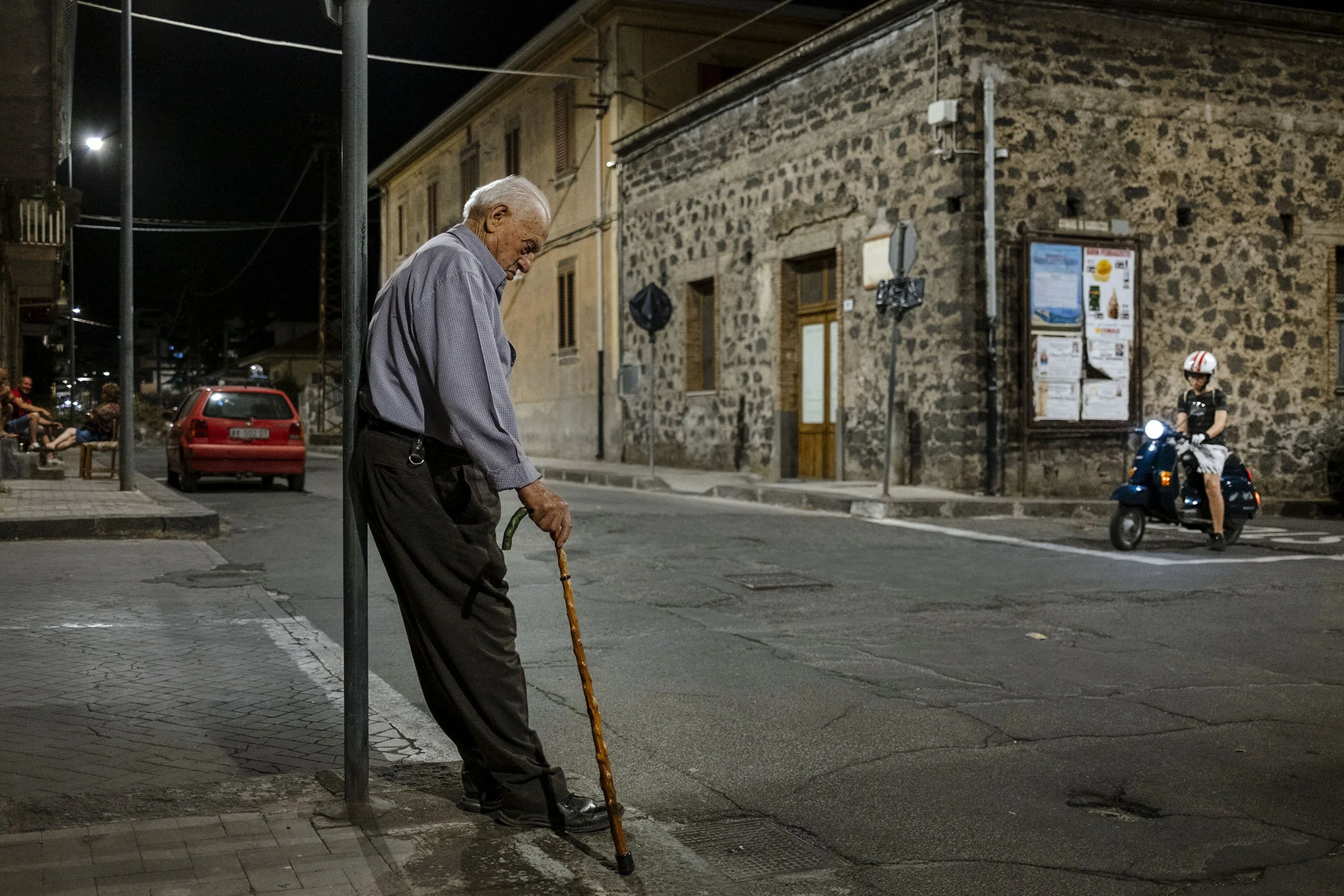 A man resting at a crossing in Randazzo, Sicily.
