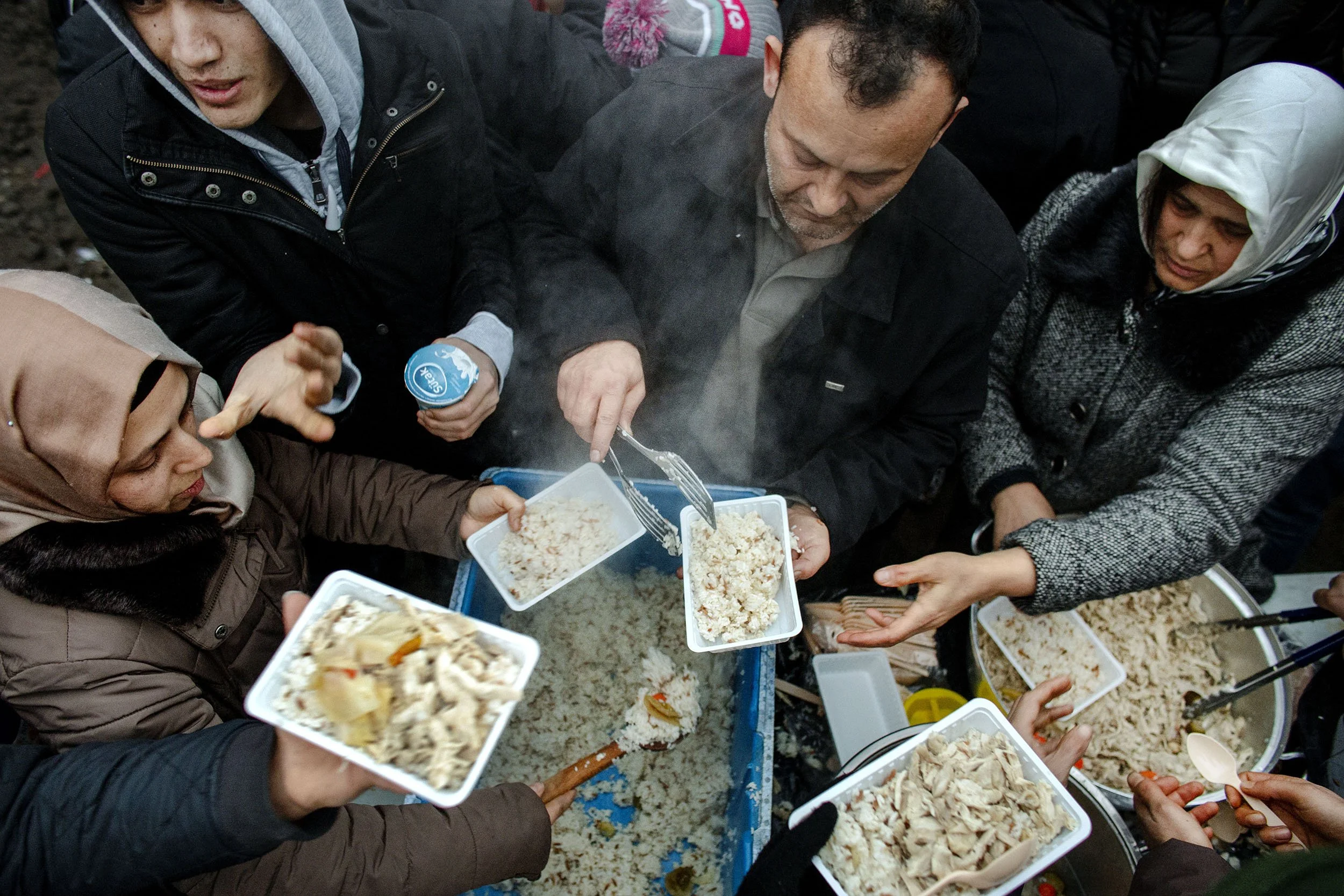 Dutch volunteers distribute food to illegal immigrants in the second Jungle in Dunkirk, France.