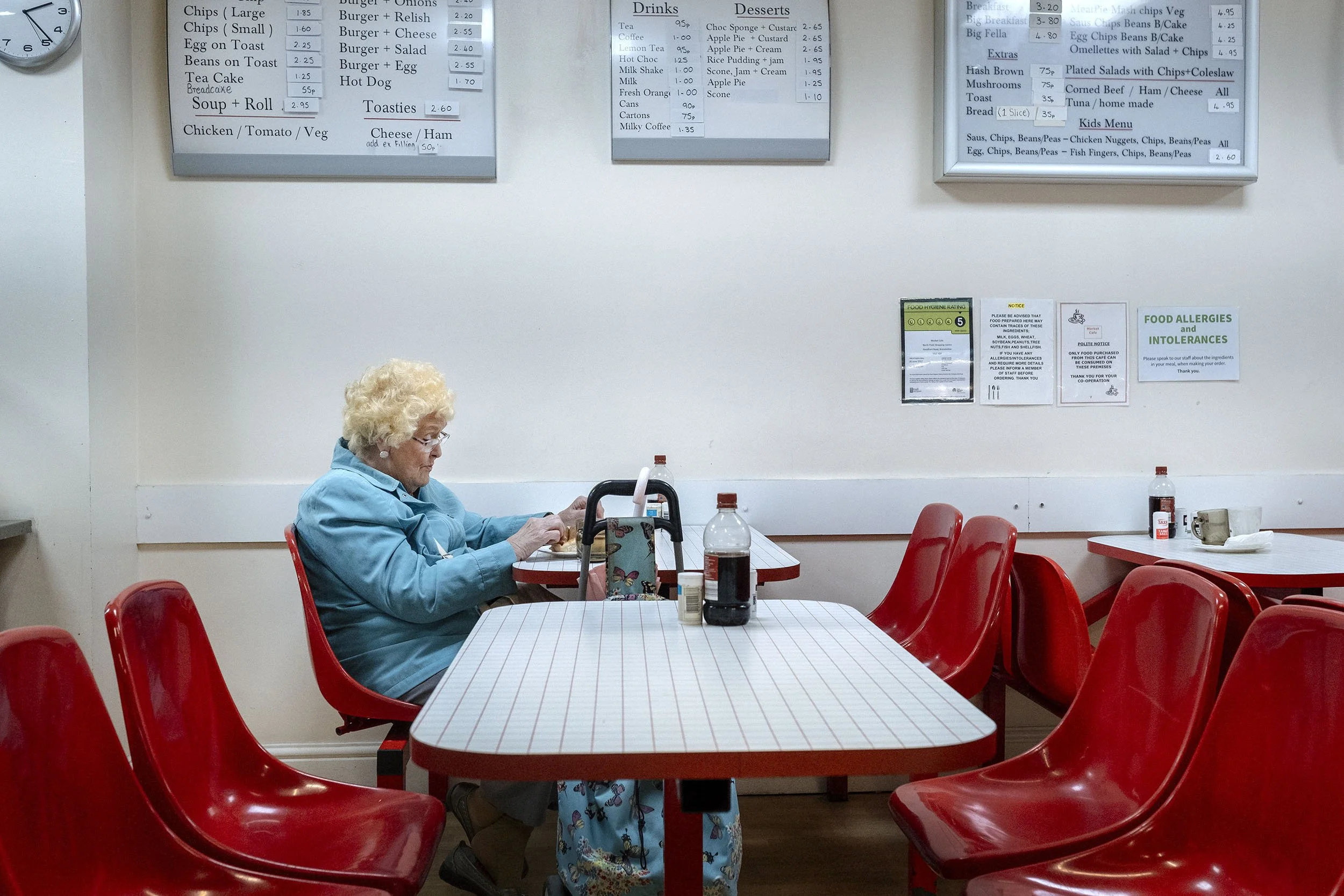 A lady sitting in a caf in a shopping center in Hull, England.