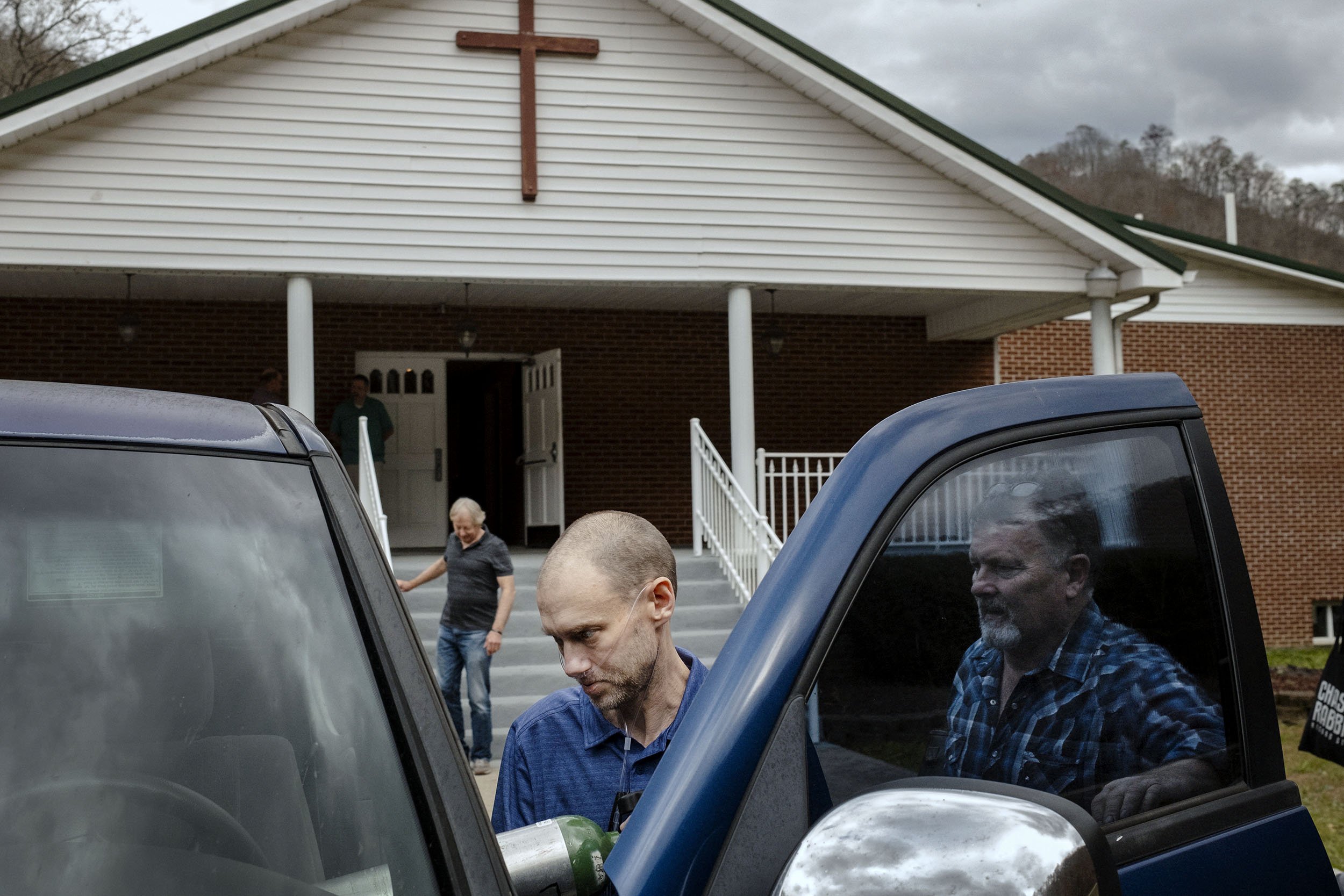 Glenn enters his truck after Bible class and a meeting at the Faith Baptist Church in Dorton, Kentucky.