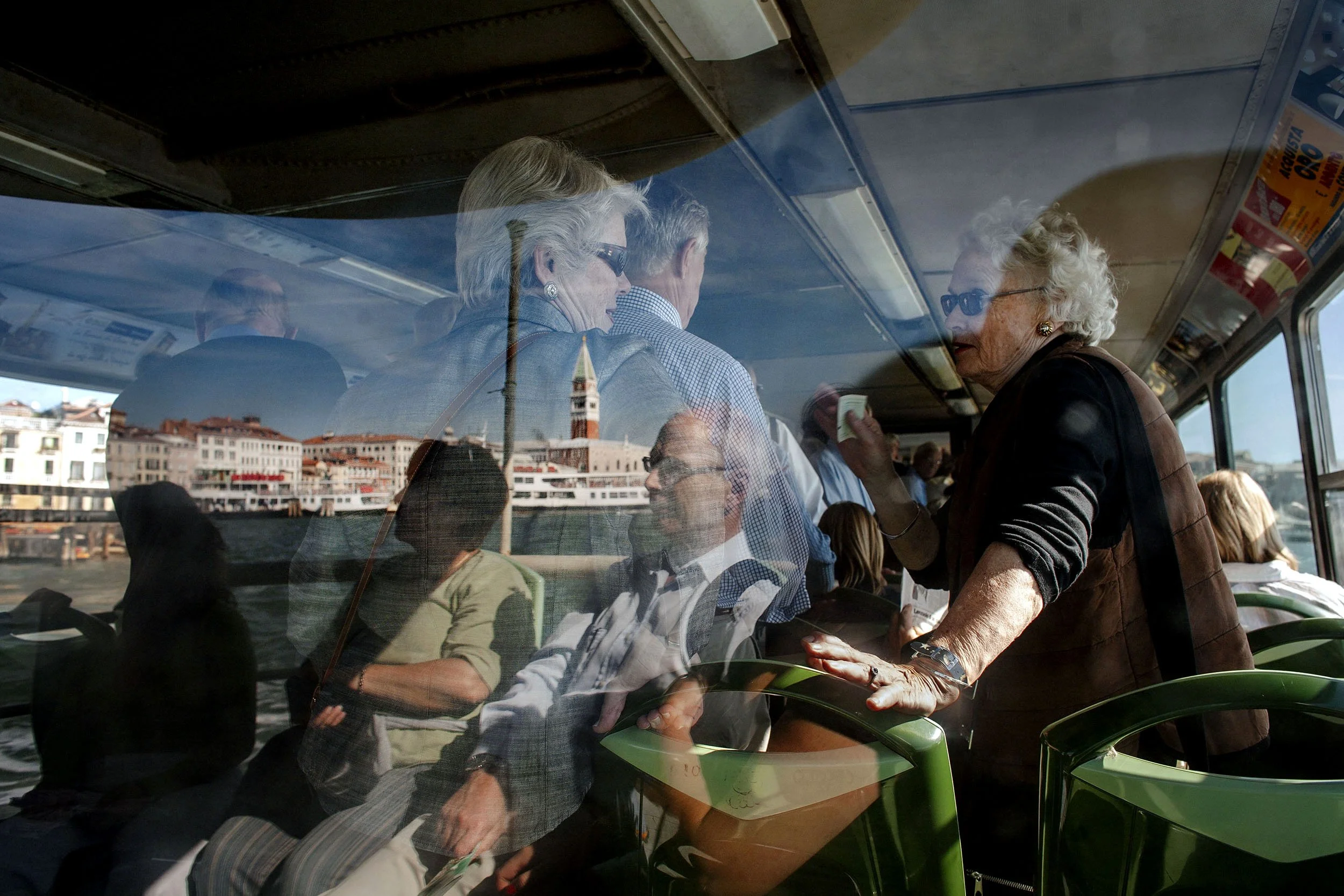 Tourists on a boat in Venice, Italy.