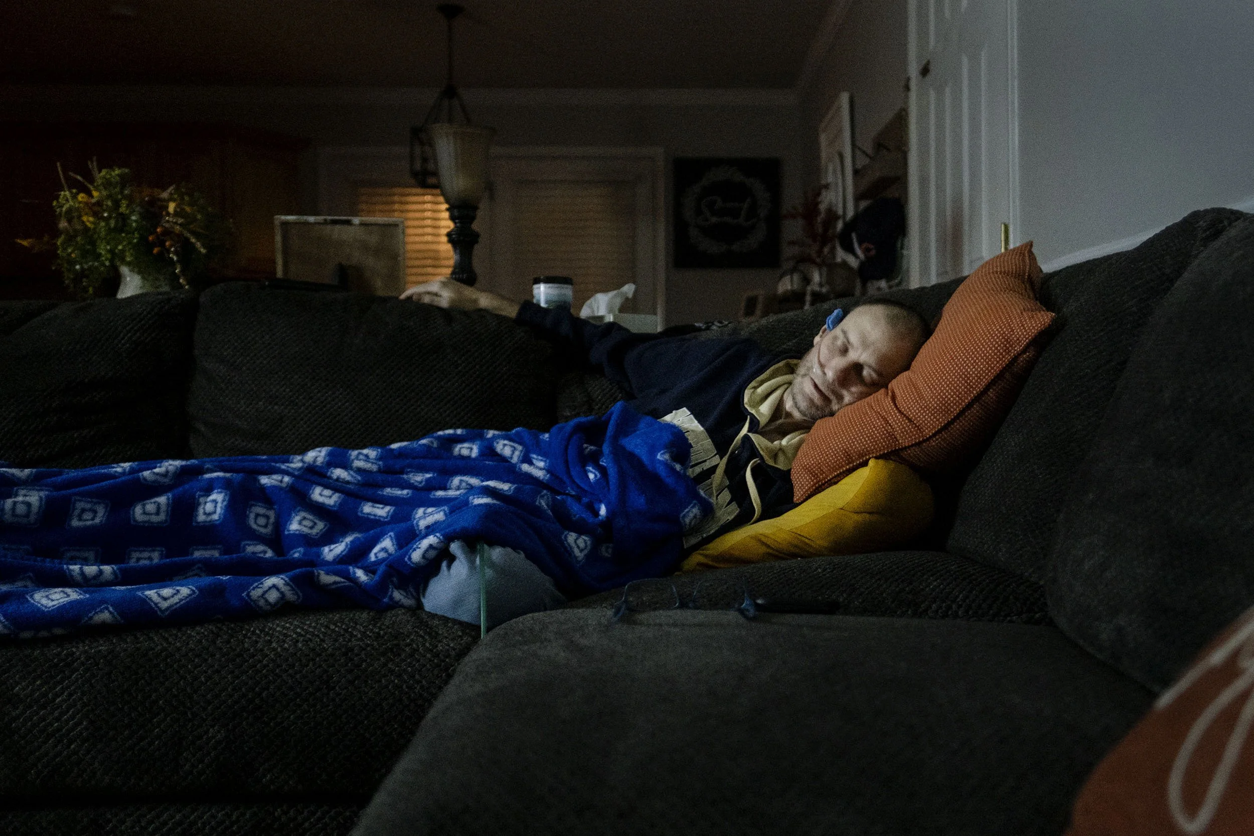 Glenn sleeps on the sofa now because he doesn’t dare to sleep in bed anymore fearing that he might suffocate if he rolls onto his back. Robinson Creek, Kentucky.