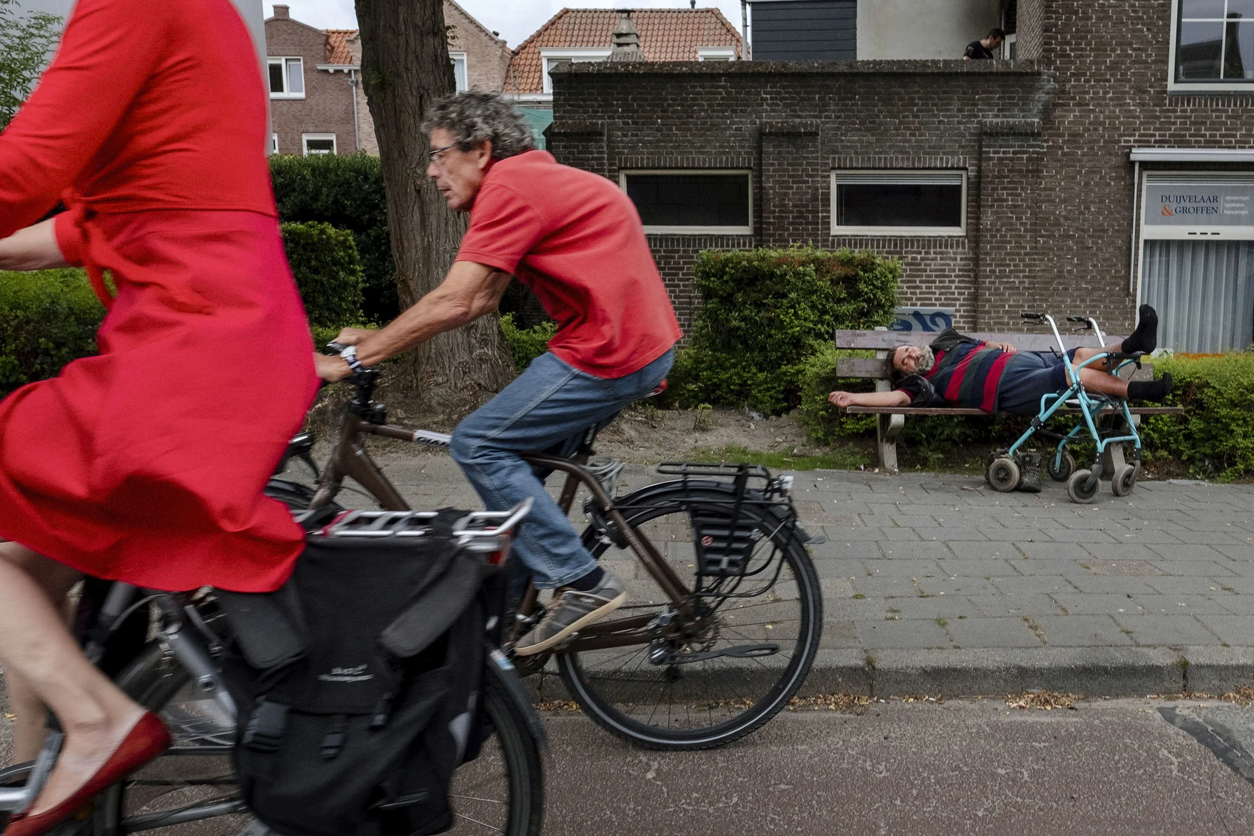 A man takes a rest on a public bench, Bergen op Zoom, the Netherlands.