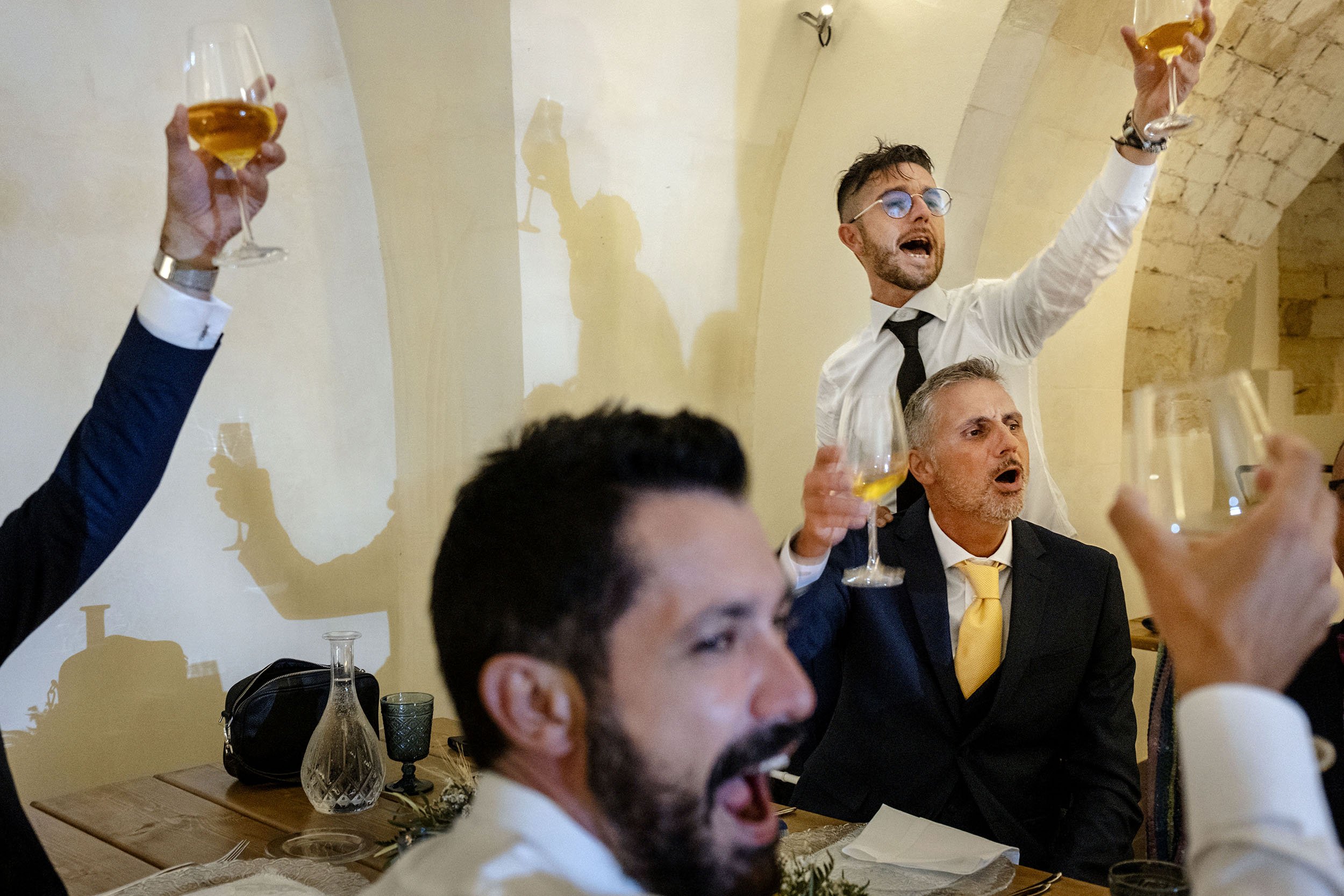 Friends wishing the groom and groom a happy marriage. Chiaramonte, Sicily.