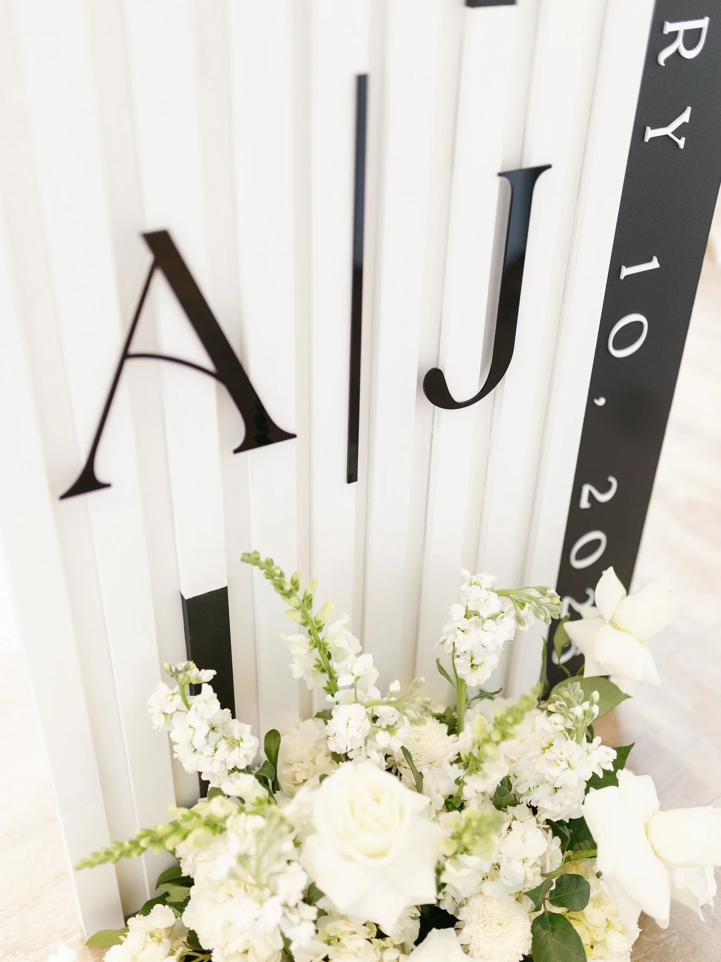 Still dreaming about this beautiful celebration. The signage was designed to feel modern yet timeless, with sleek black accents and a one of a kind aisle runner featuring the couple&rsquo;s monogram. The details carried through to the bar, where coor