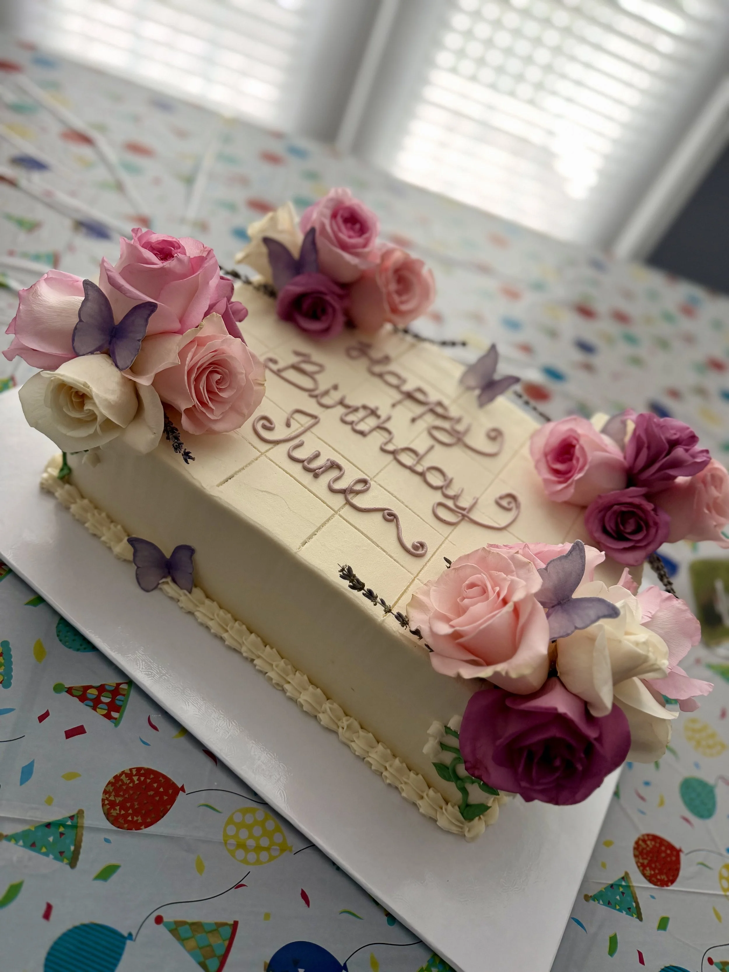 Vanilla cake with half raspberry and half lemon curd filling, with vanilla buttercream
