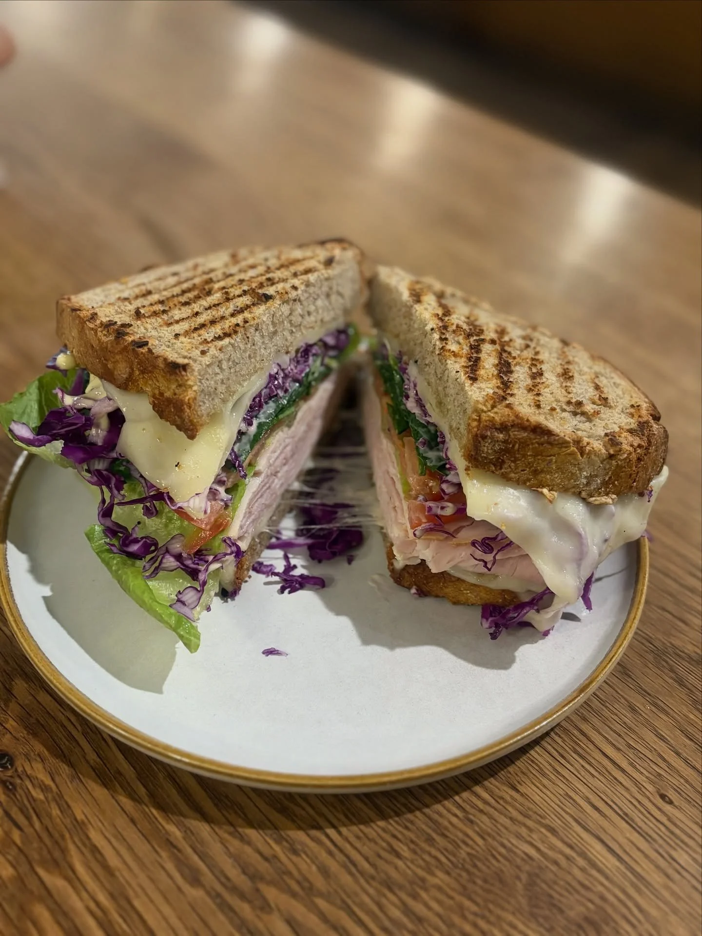 Fresh, colorful, and stacked just right
Meet our new deli-style sandwich &mdash; layers of roasted turkey, crisp lettuce, tangy red cabbage, juicy tomato, and melted Swiss, all tied together with our house-made mayonnaise-mustard dressing on perfectl