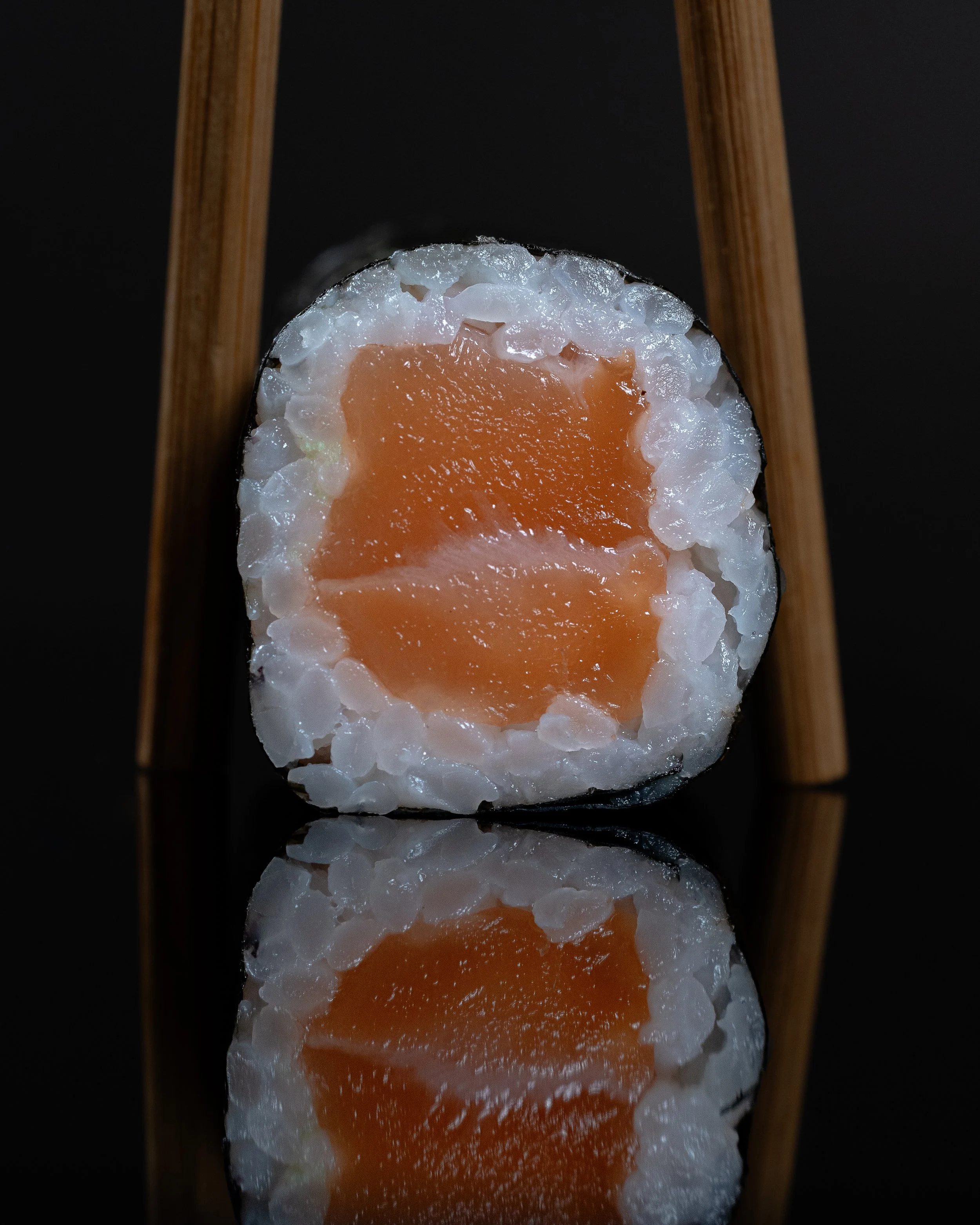 Sushi handroll salmon reflection chopsticks.jpg
