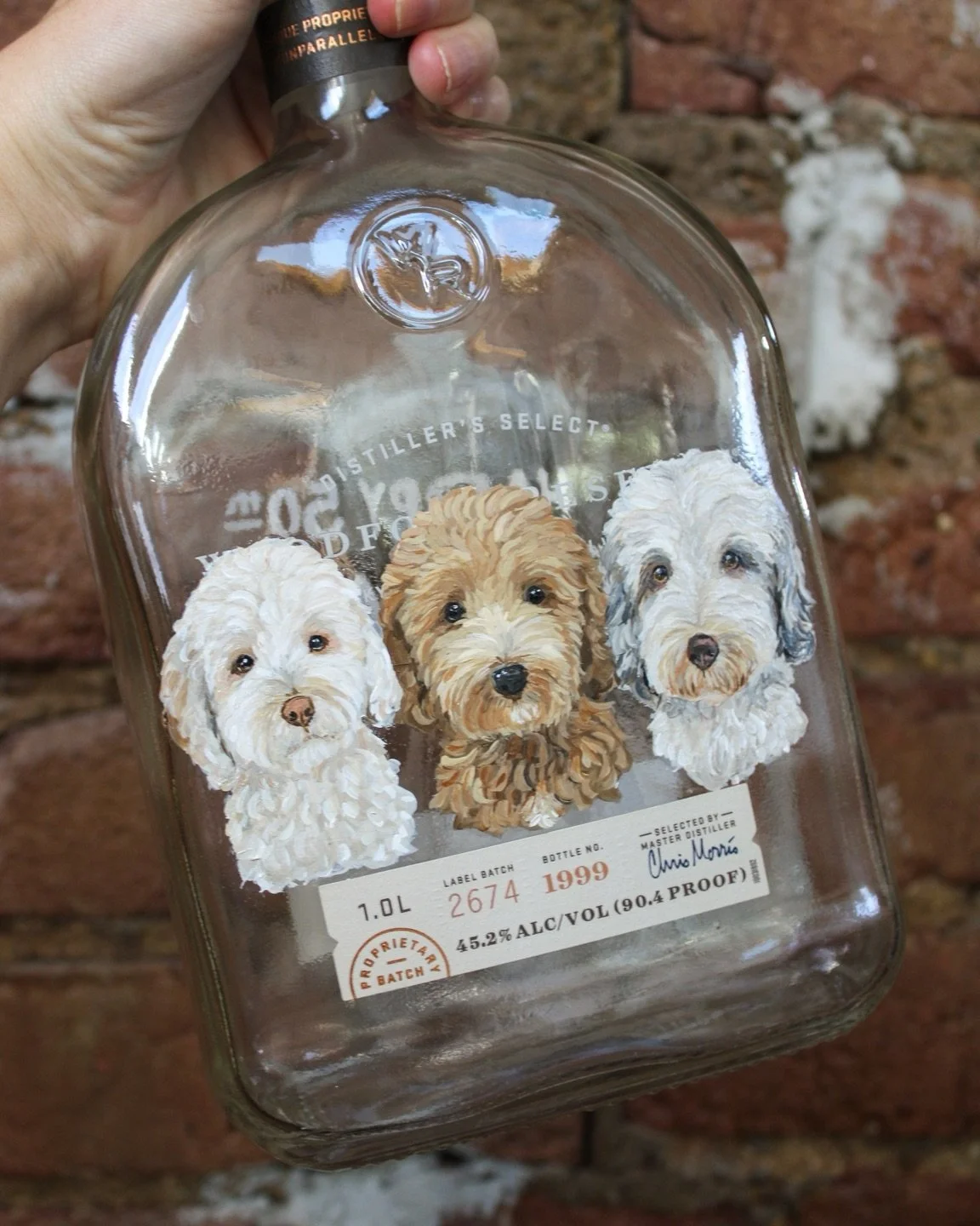 The three sisters&rsquo; dogs &mdash; known as the &ldquo;grandpups&rdquo; by their dad &mdash; made for a unique addition to his home bar bottle collection. Happy birthday!