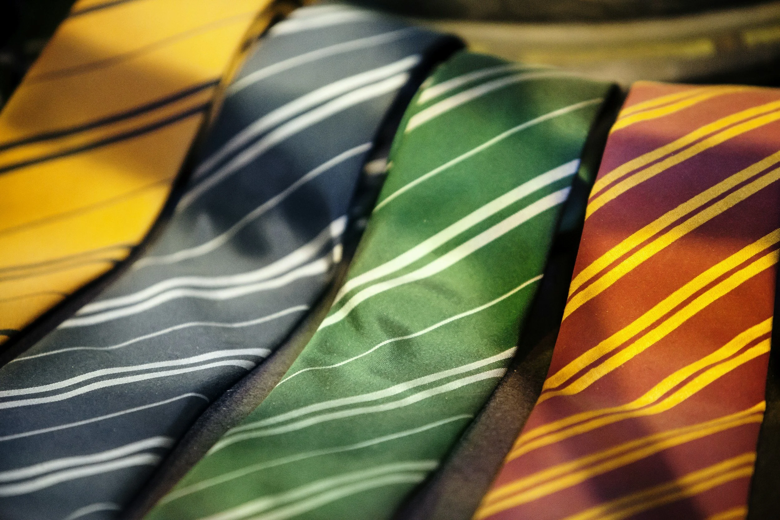 Neckties of various colors laying flat