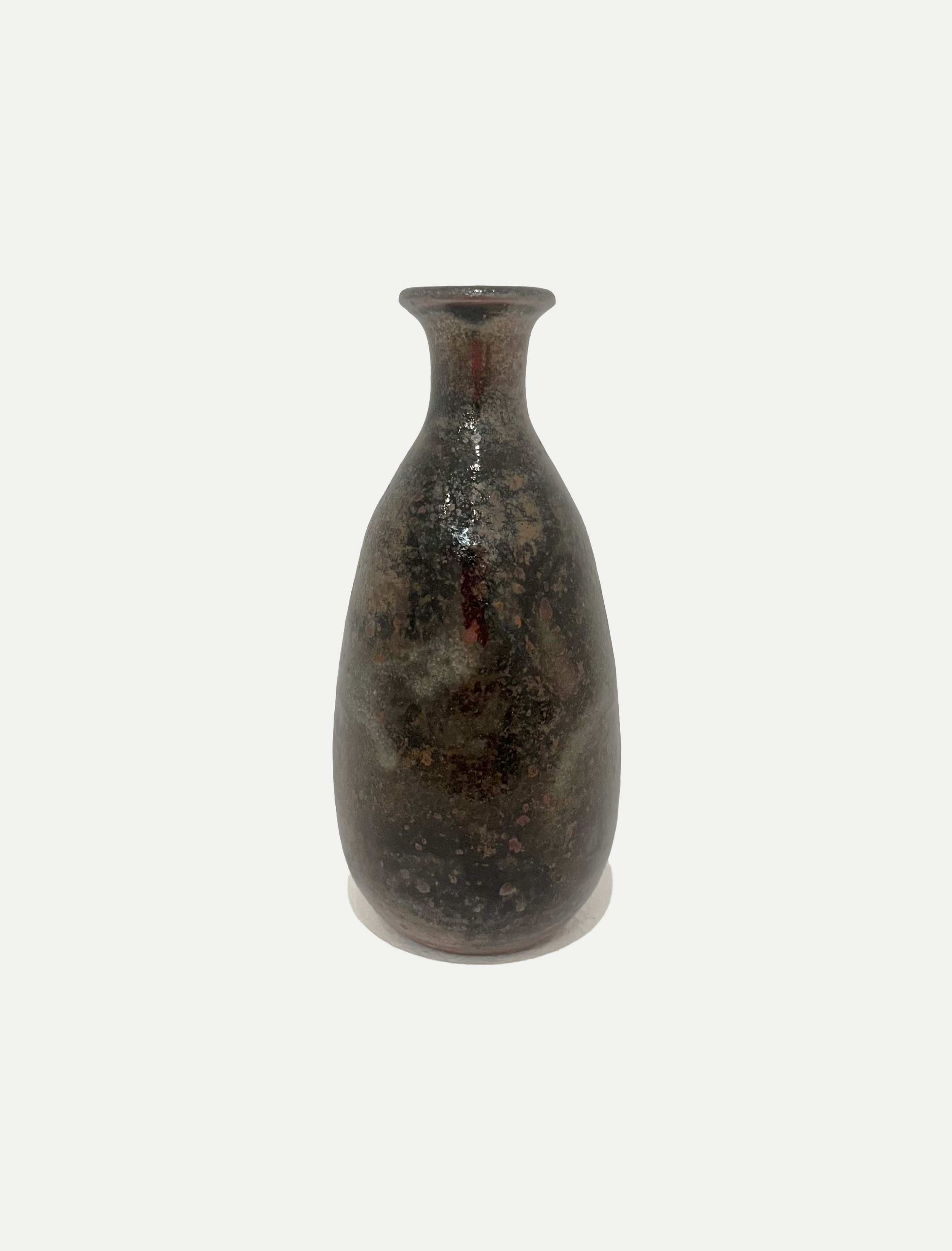 2025

shino, iron wash, and copper glaze bud vase
reduction

3 x 6