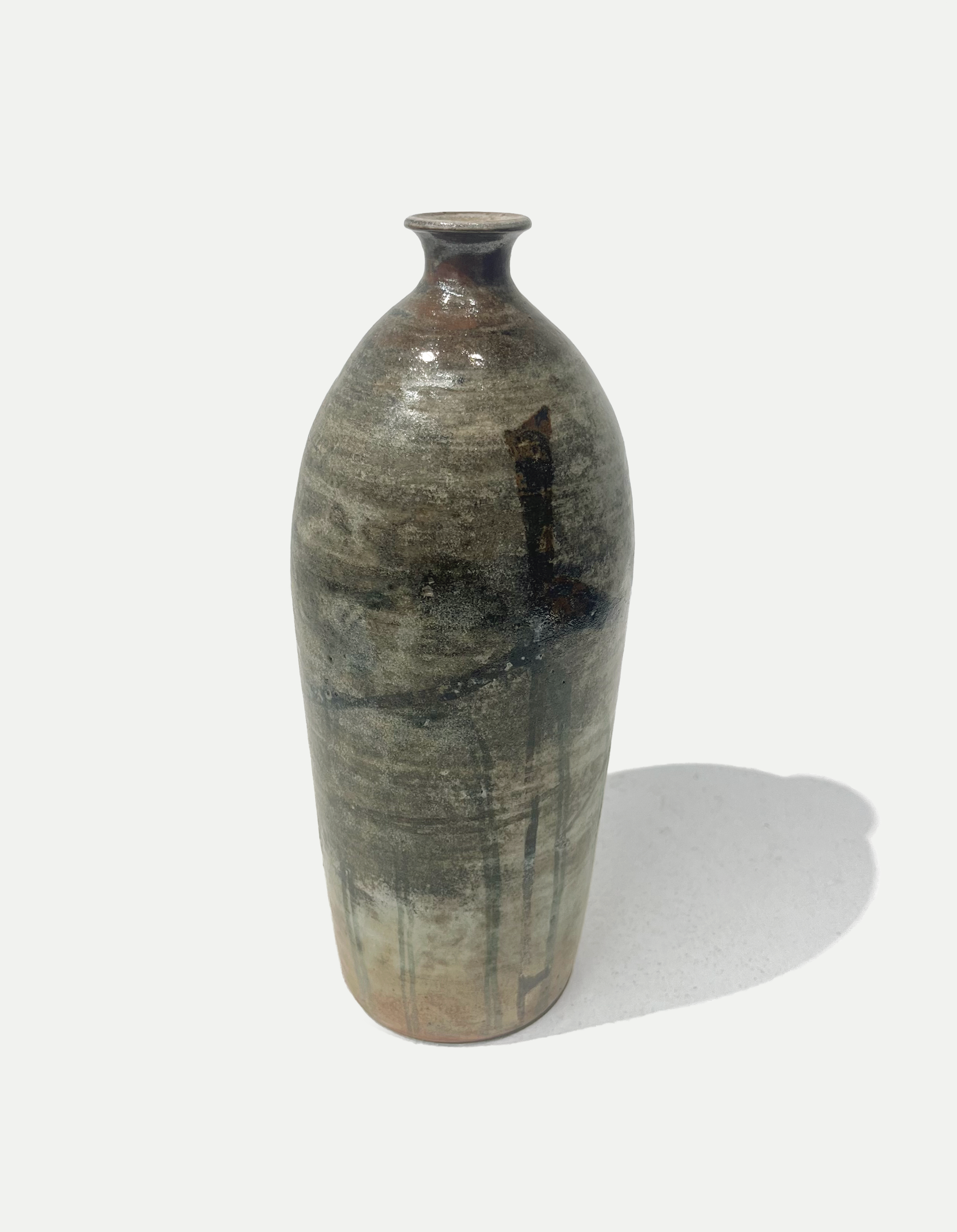 2025

shino and iron wash glaze vase
reduction

4 x 12