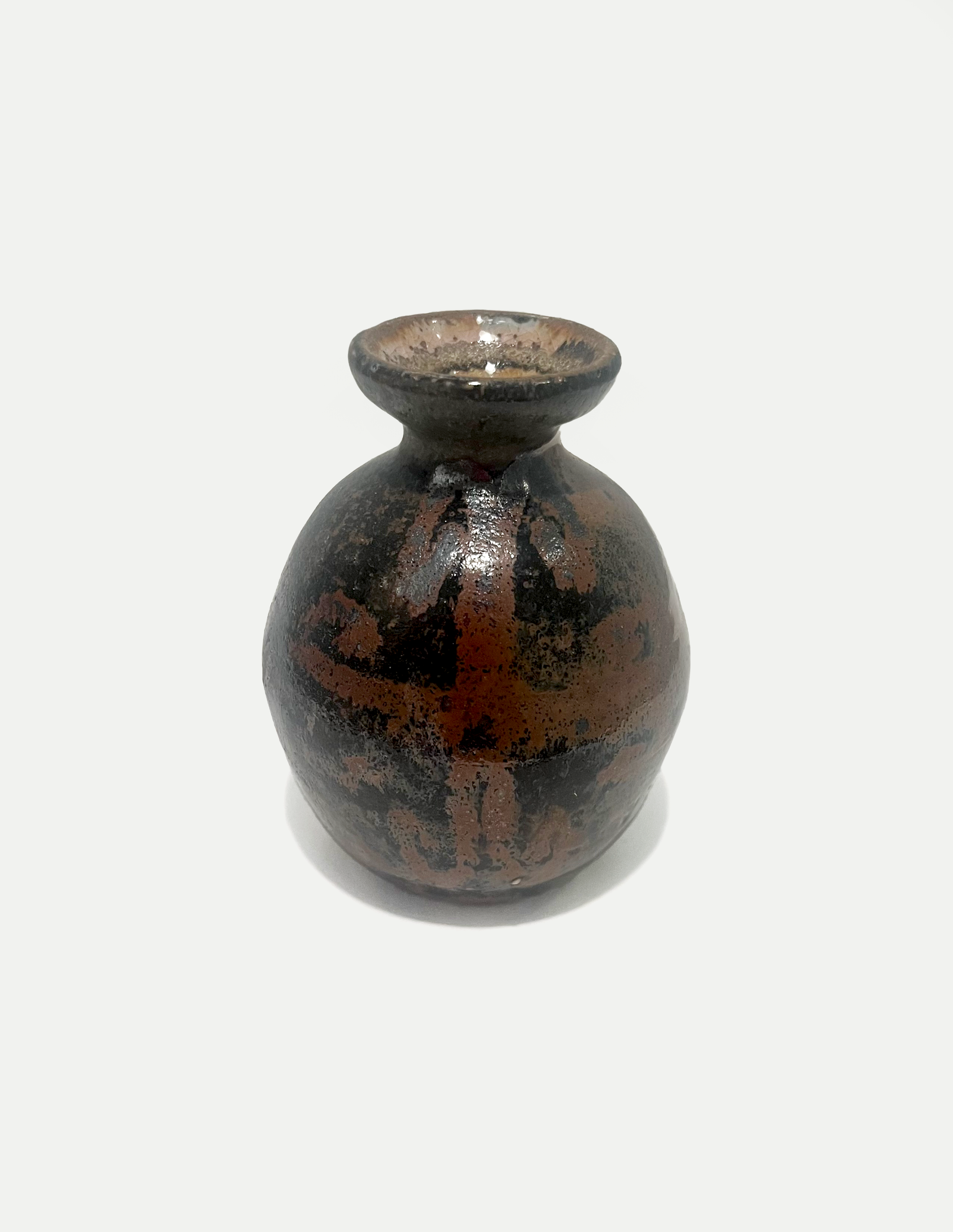 2025

shino glaze with iron wash celtic design bud vase
reduction

3 x 4