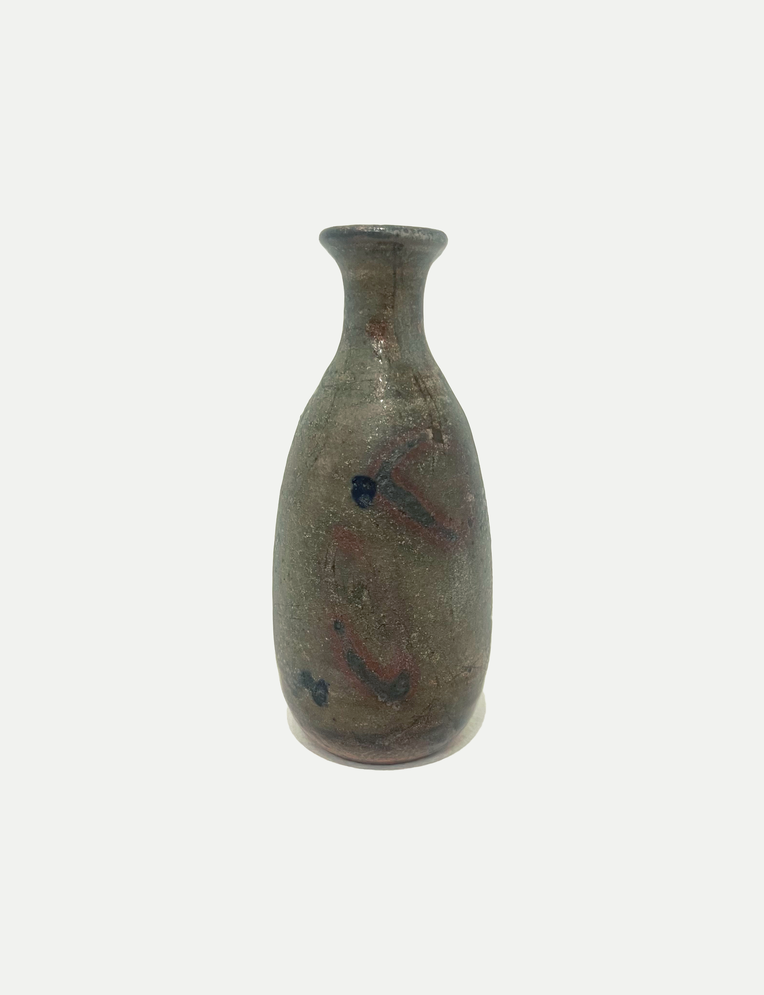 2025

shino, iron wash, cobalt, and copper glaze bud vase
reduction

3 x 6