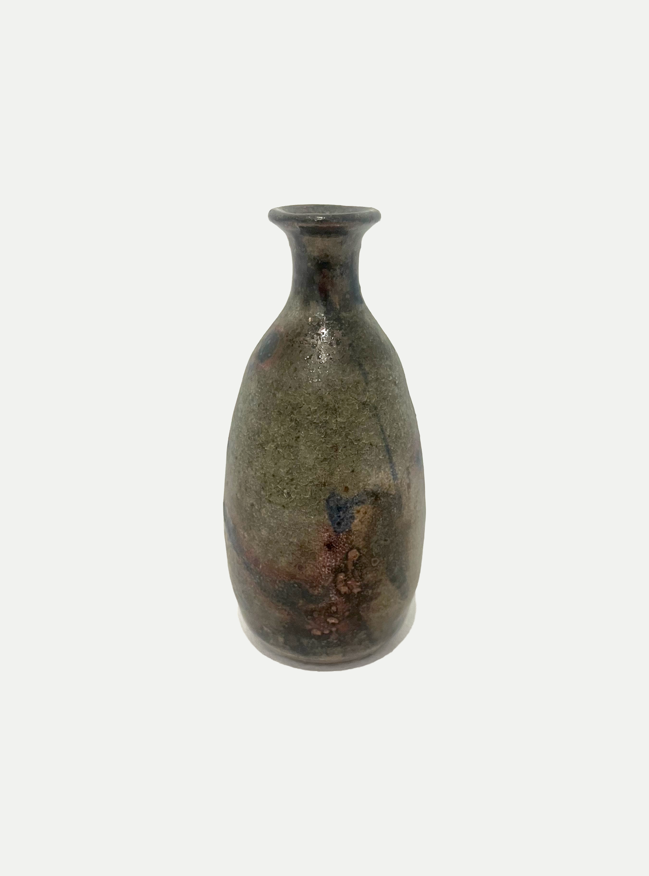 2025

shino, iron wash, cobalt, and copper glaze bud vase
reduction

3 x 6