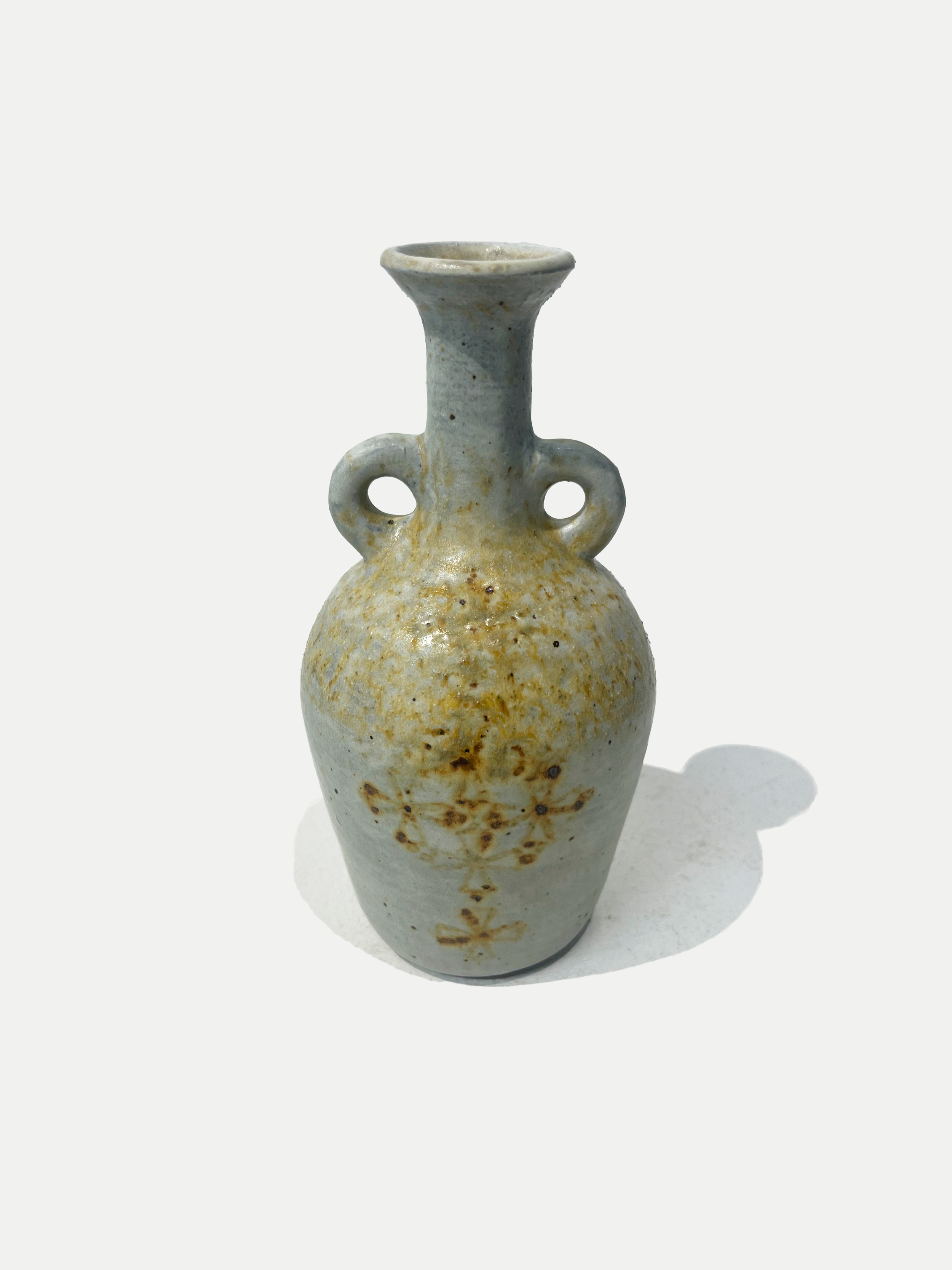2025

wood ash glaze with iron wash celtic design vase
reduction

2 x 3