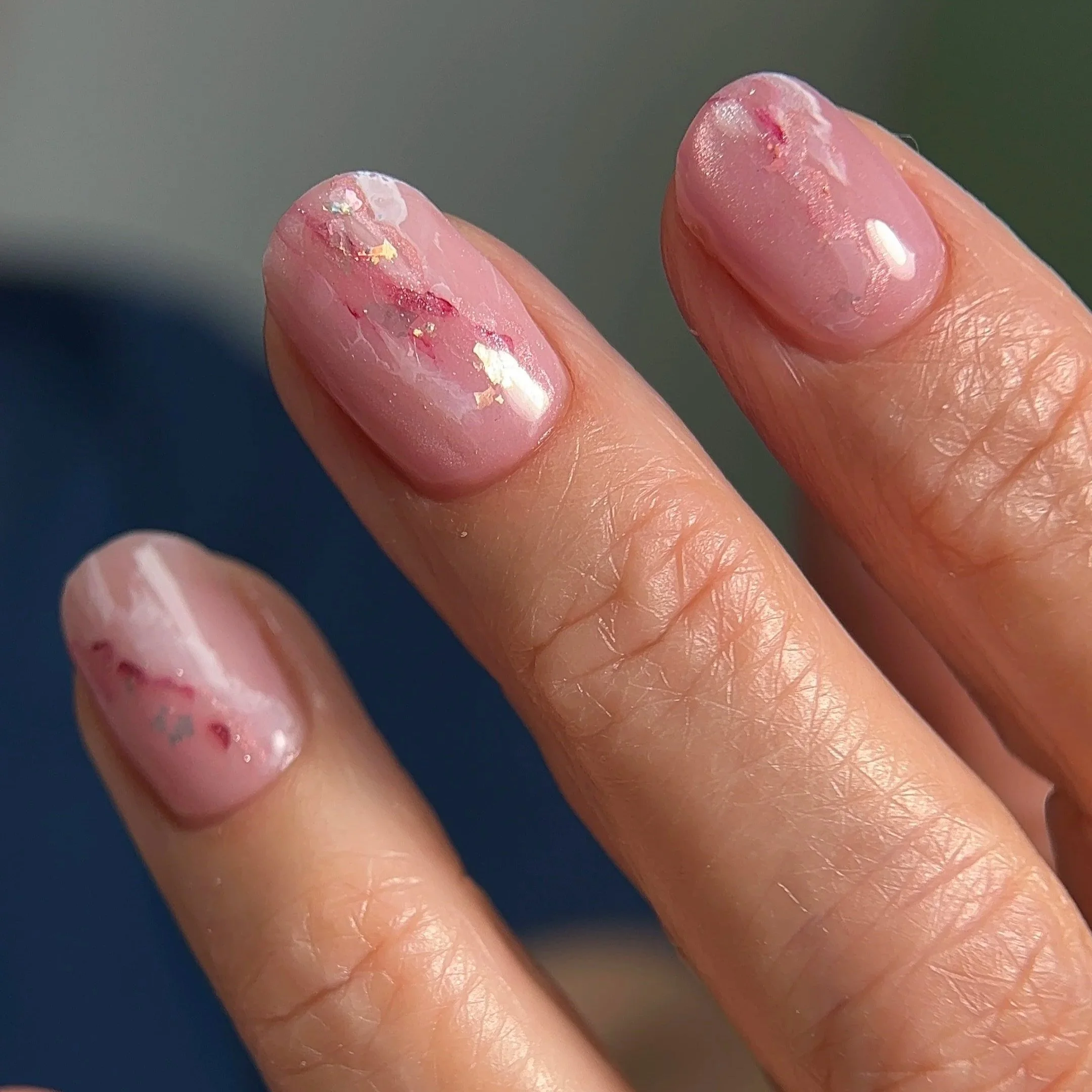 Close-up of a Russian Manicure with Japanese gel nail art.