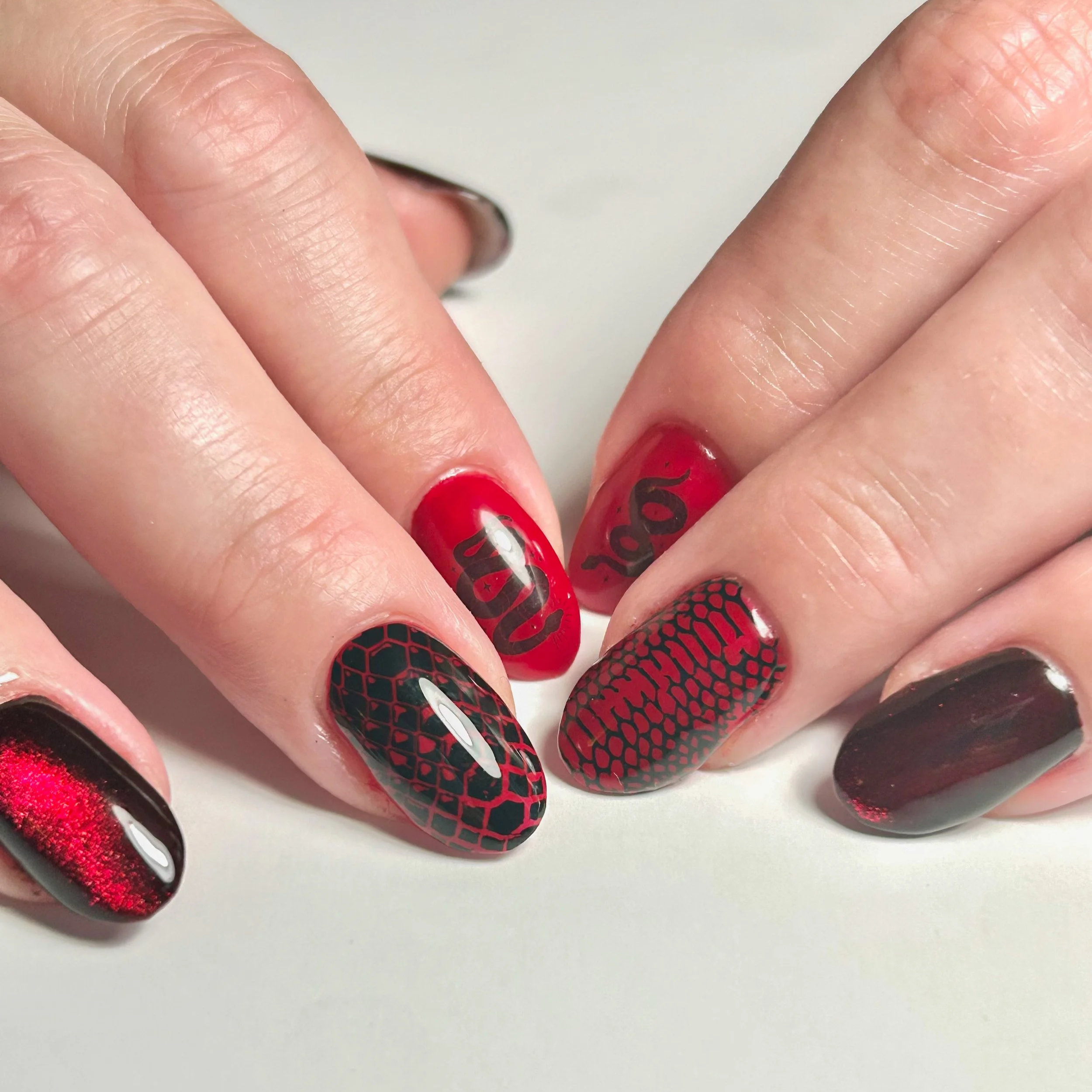 Red and black art structured Japanese and Korean gel manicure.