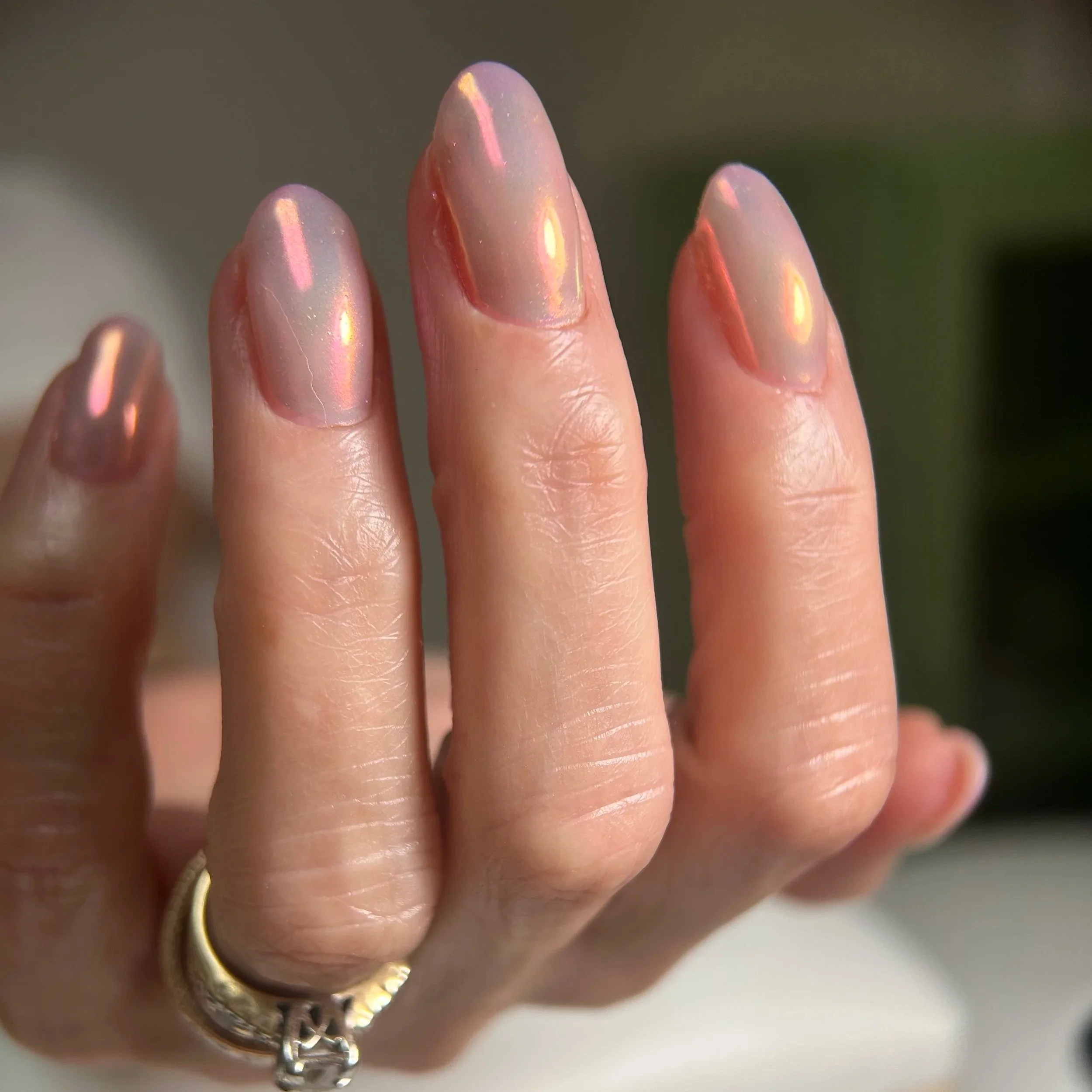 Close-up of four fingers with detailed cuticle work and hard gel in Long Beach, Ca.