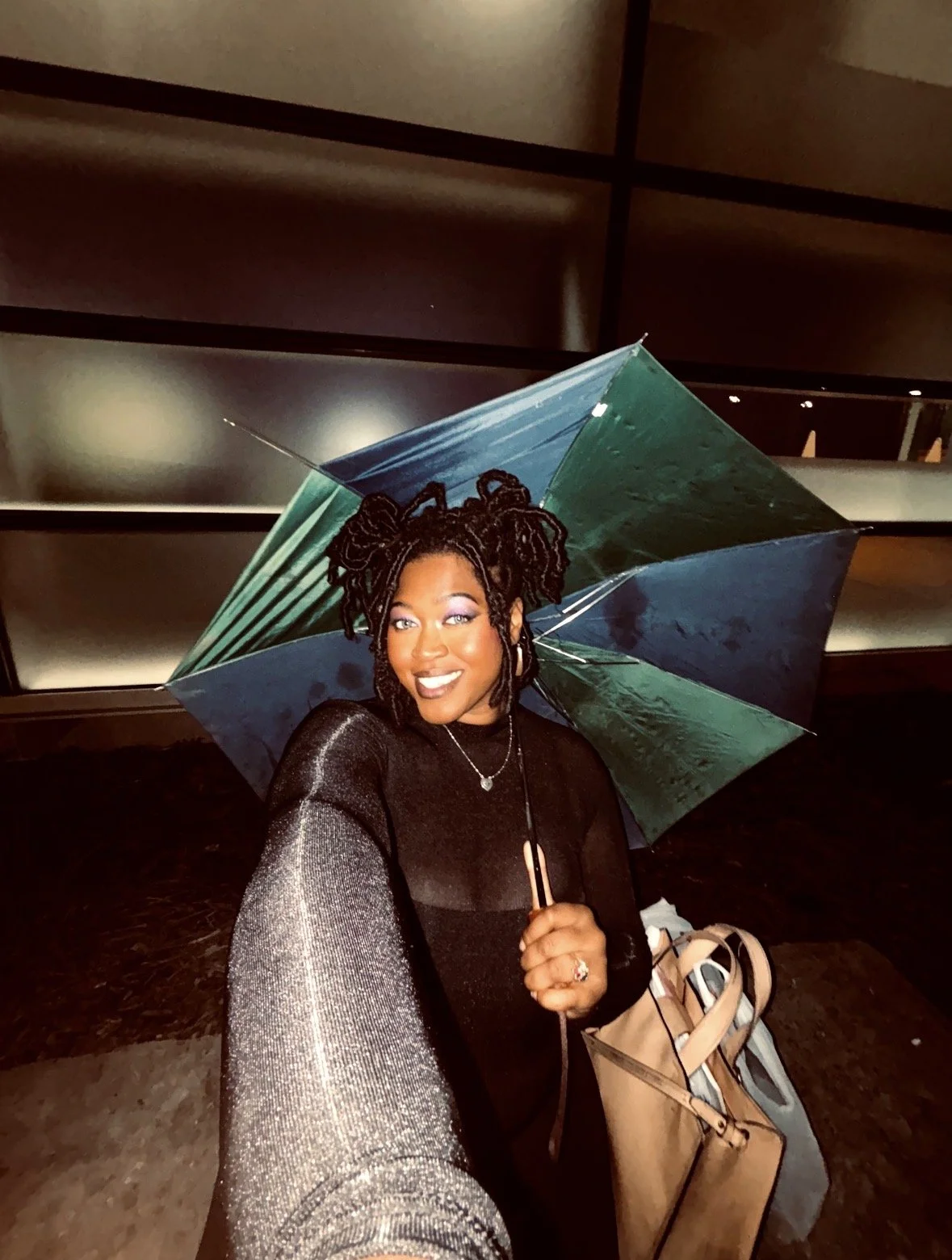 Artist Kenya Brown modeling after making hand designed "Pure Feeling' tank top shirt prototypes that was soon purchased by Tabitha Brown.  Emmy-winning actress, entrepreneur, author, and social media personality. Known for her comedy and veganism.