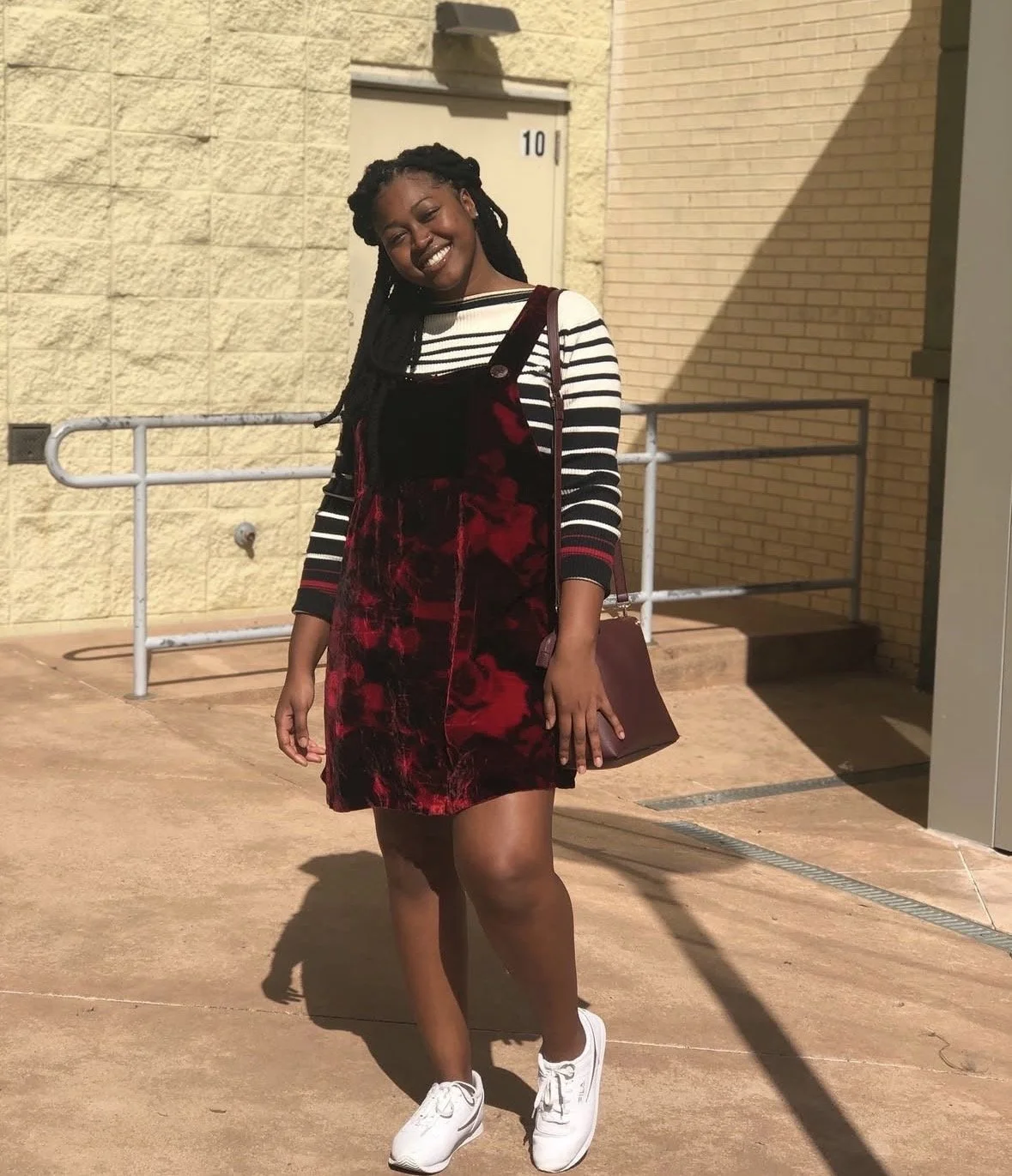 Artist Kenya Brown, also known as RODELANE vocally, is modeling in front of the Northeast Mall In Fort Worth Texas.