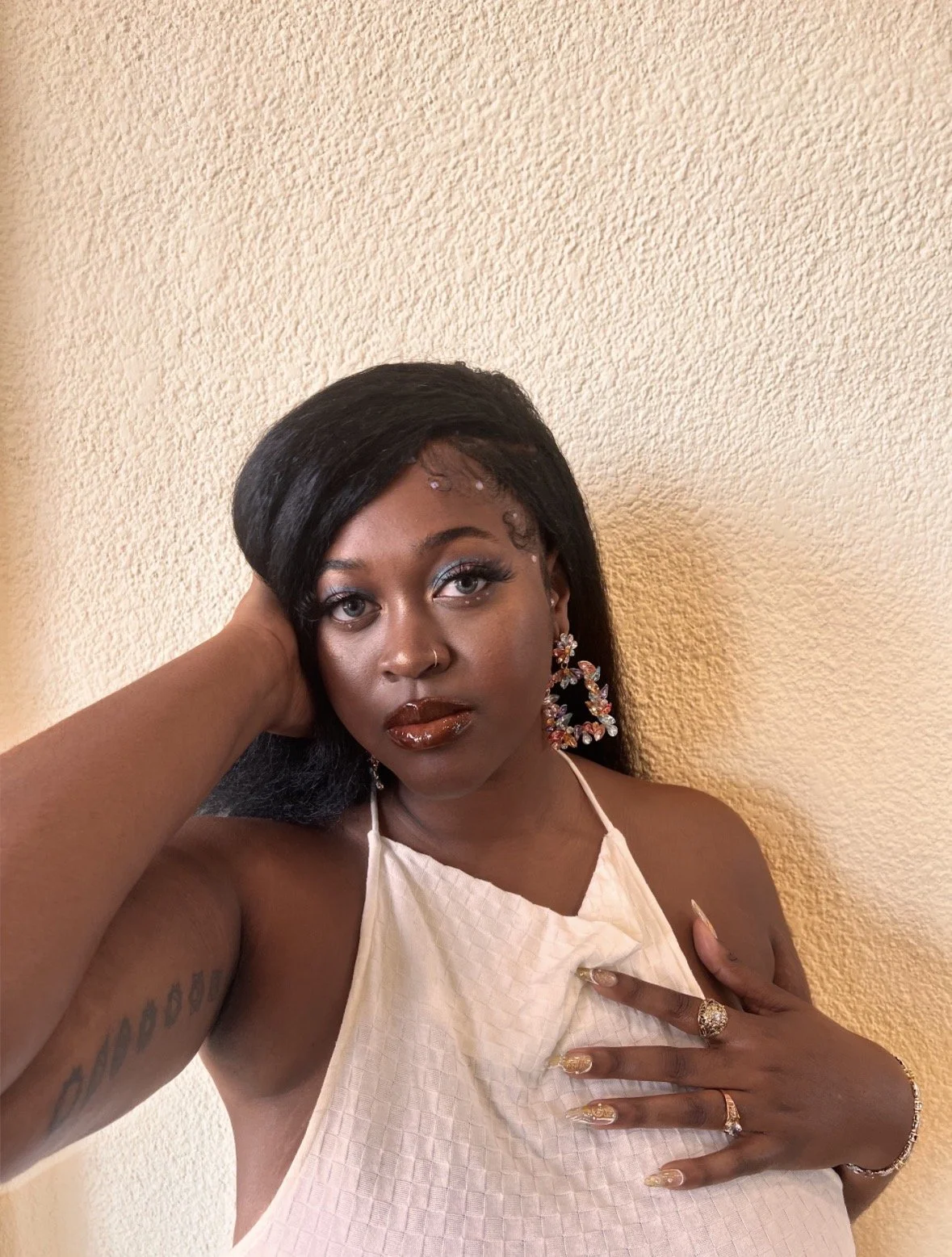 Kenya Brown modeling for her birthday pictures on May 4th. Dressed in a dress from Papaya and earrings from Ross. Her nails are DIY made from gold butterfly nail stickers.