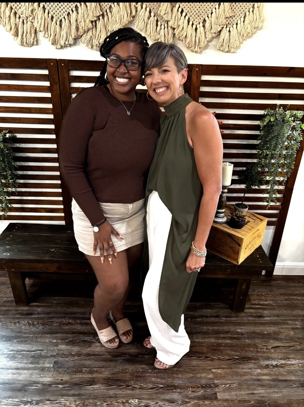 Artist Kenya Brown and Barbie Armenta who is a freedom life coach, founder of the Brave Gathering, host of the "Brave Conversations" podcast of Brave Co smiling for a photo at an speaking event at the location At The Table in Argyle Texas.
