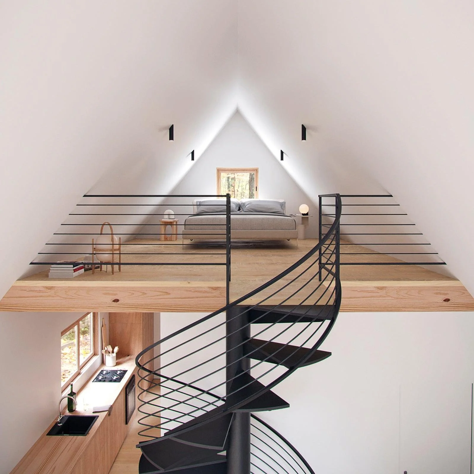 Loft bedroom with a minimalist design, angled white ceiling, small window, bed with gray bedding, two bedside lamps, wooden side table, and a spiral staircase leading to the lower kitchen area.