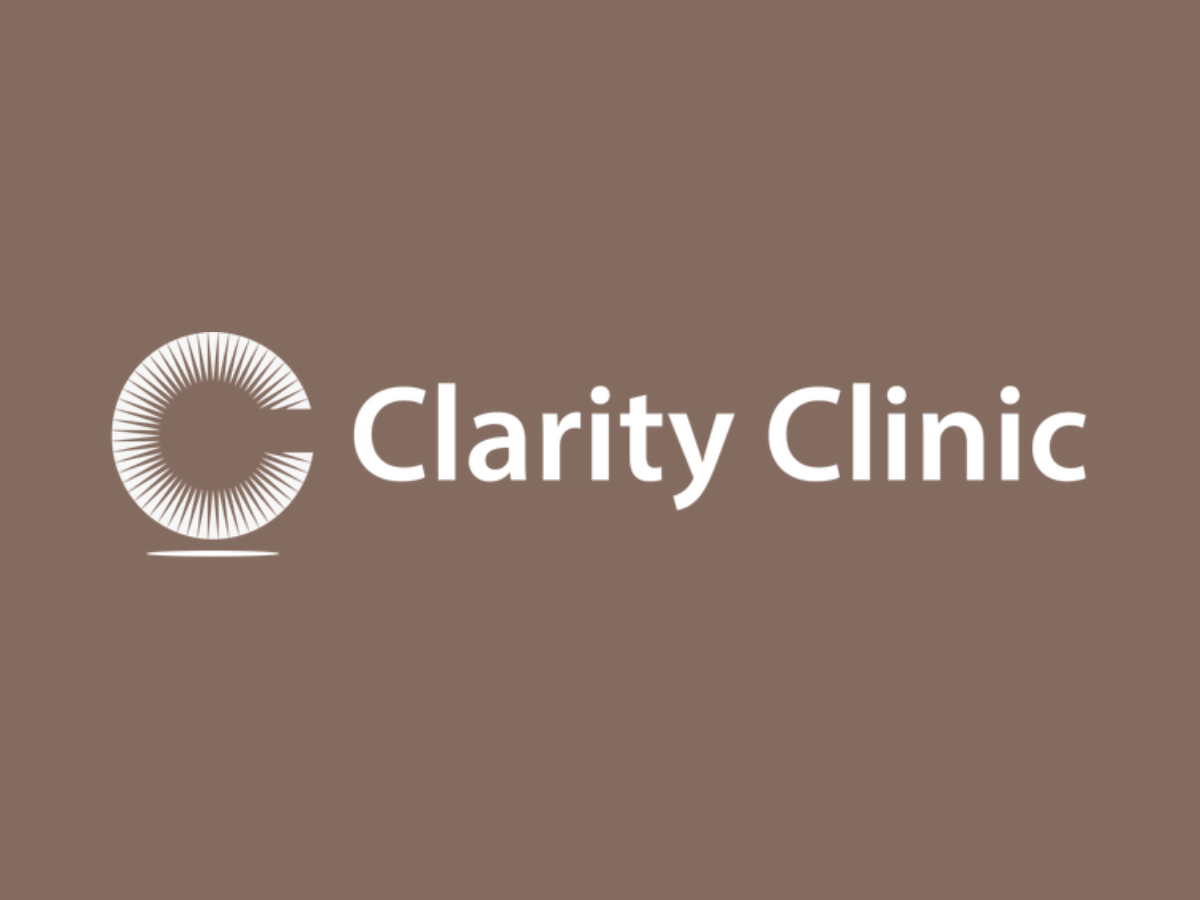 Clarity Clinic logo with a circular, radiating design and the words 'Clarity Clinic' on a brown background.