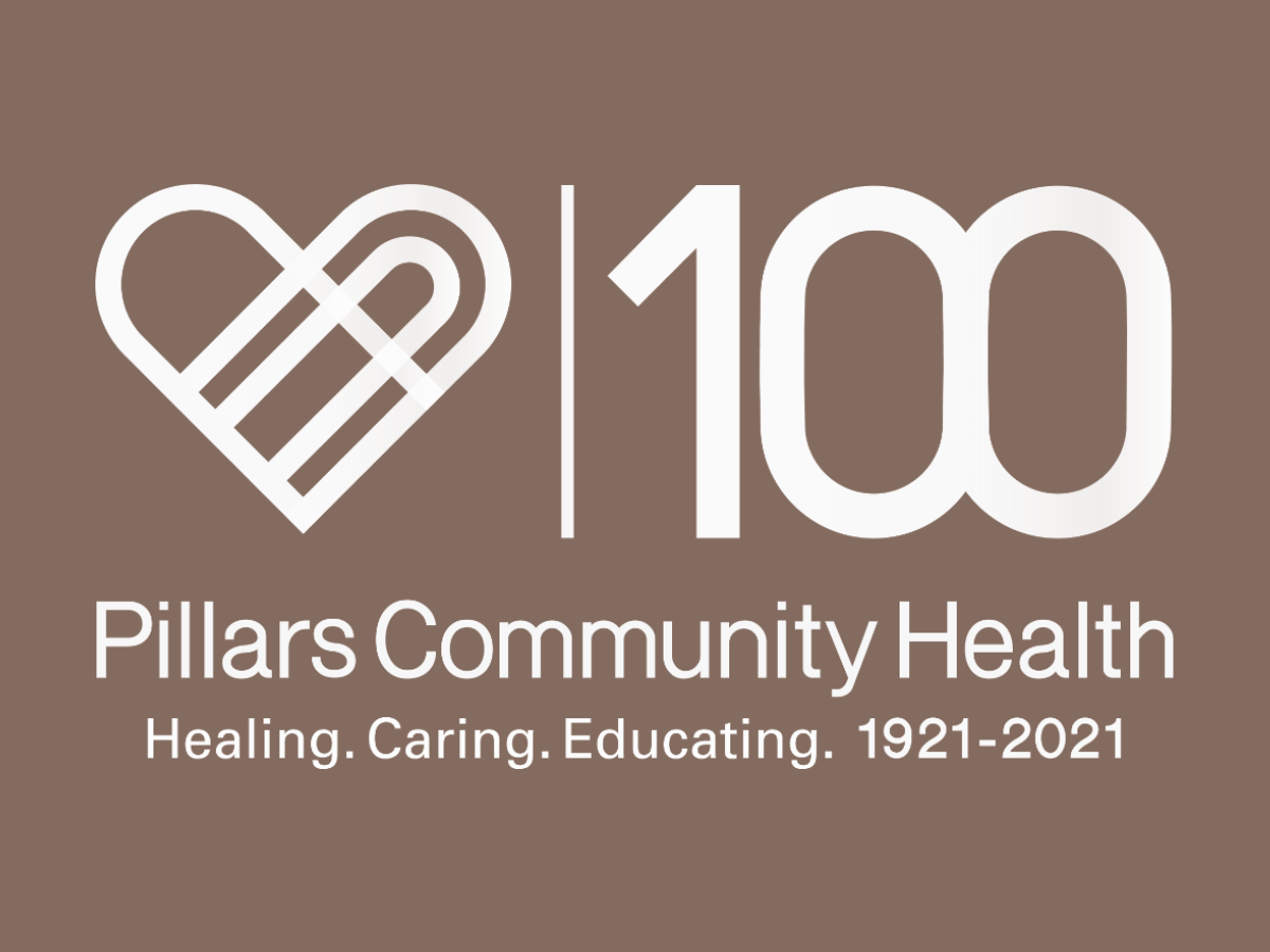 Celebrating the 100th anniversary of Pillars Community Health with a logo featuring a stylized heart, the number 100, and the text "Healing. Caring. Educating. 1921-2021" on a brown background.