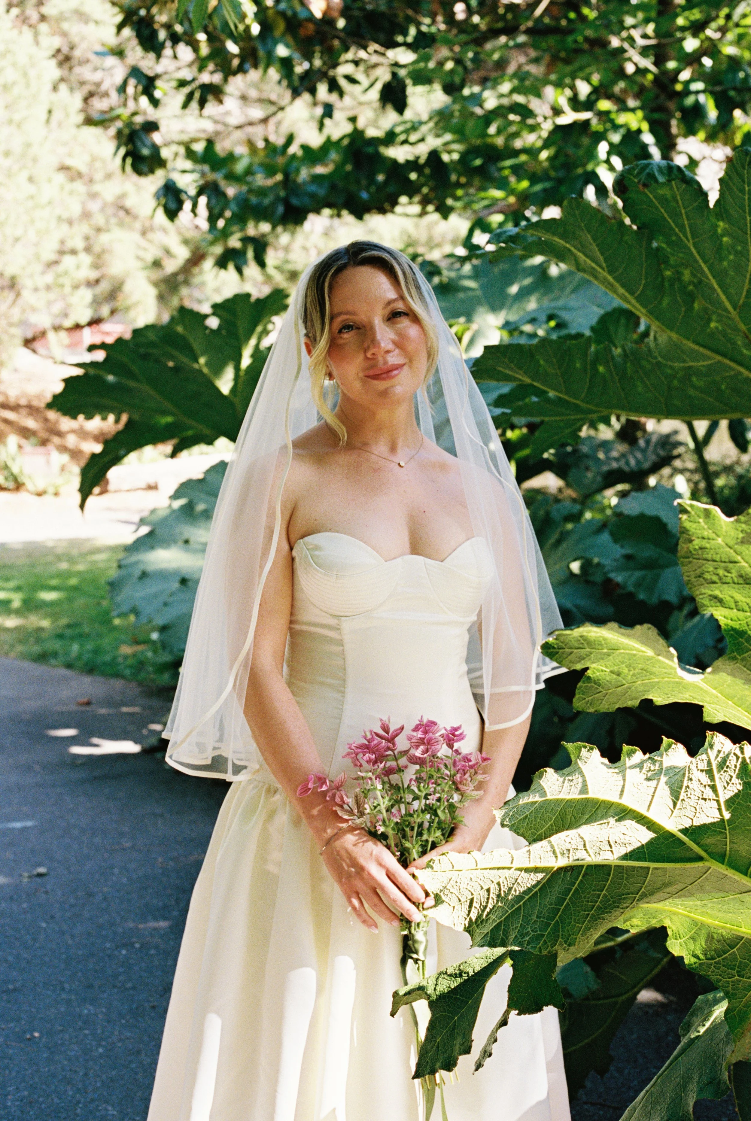 A bride in a contemporary wedding dress, captured authentic in warm lights on a wedding in Bend Oregon