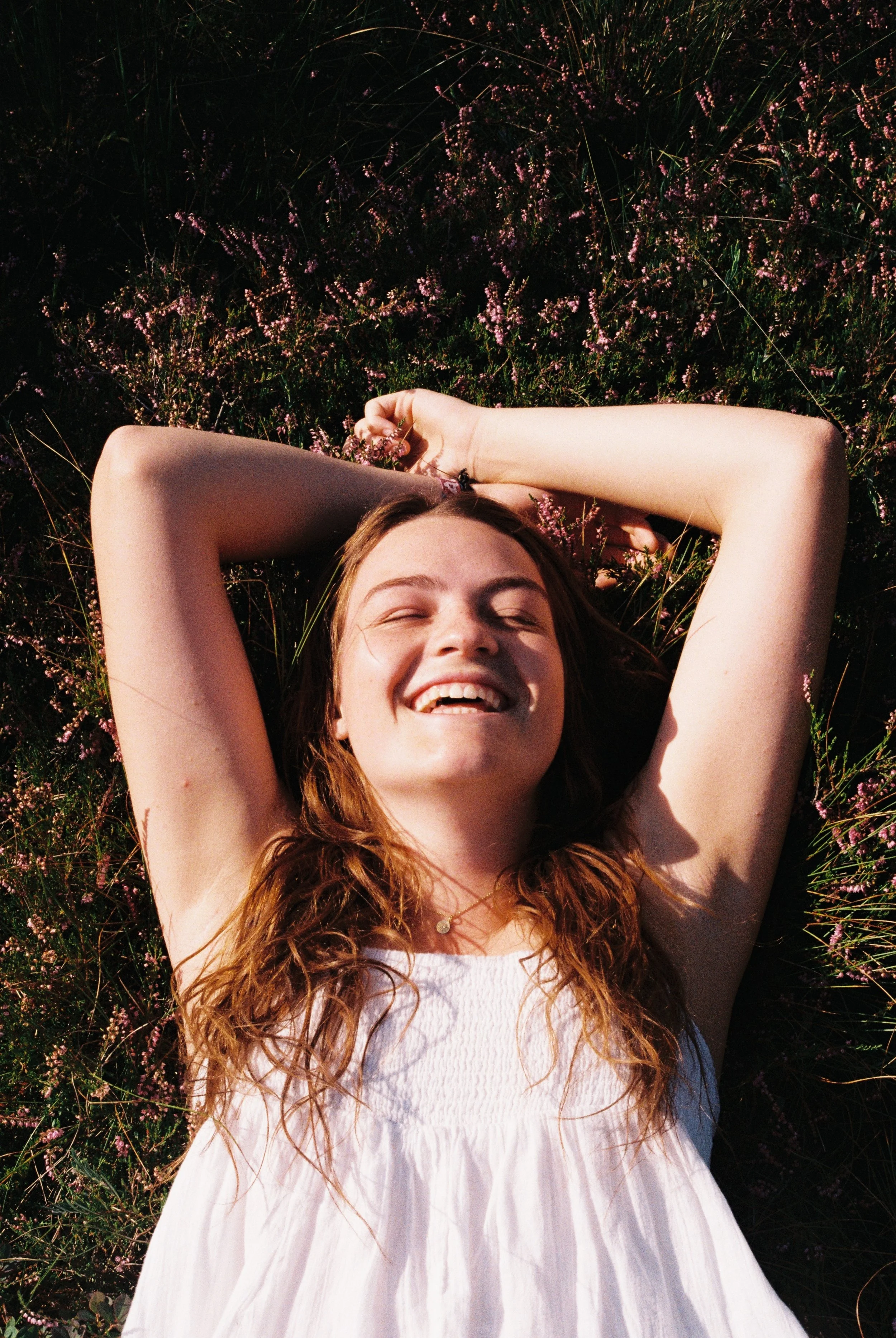 portrait of girl laying in grass