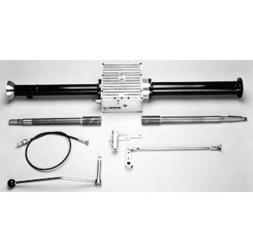 A disassembled pneumatic or hydraulic actuator with multiple metal components, including a large central cylinder, rods, a cable, and various fittings laid out on a flat surface.