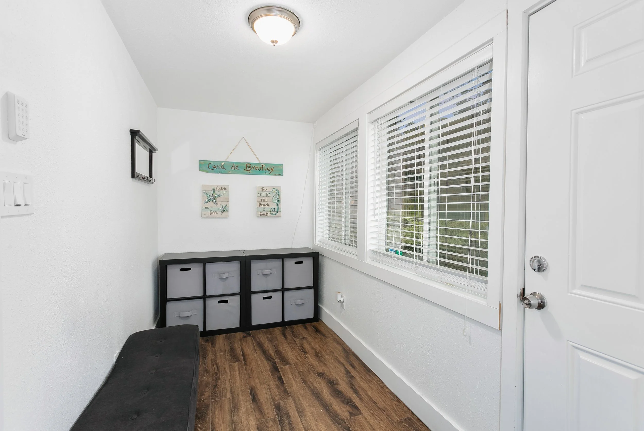 Walled in front porch creates an entryway perfect for pulling off boots, jackets and more.