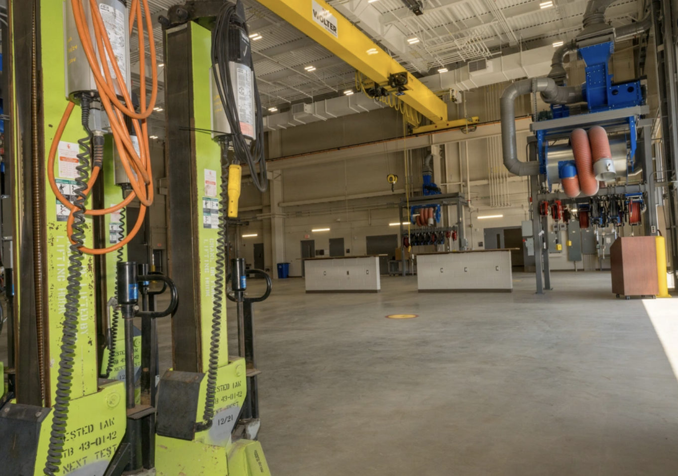 Vehicle lifts inside a government fleet maintenance facility at Camp Pendleton, California
